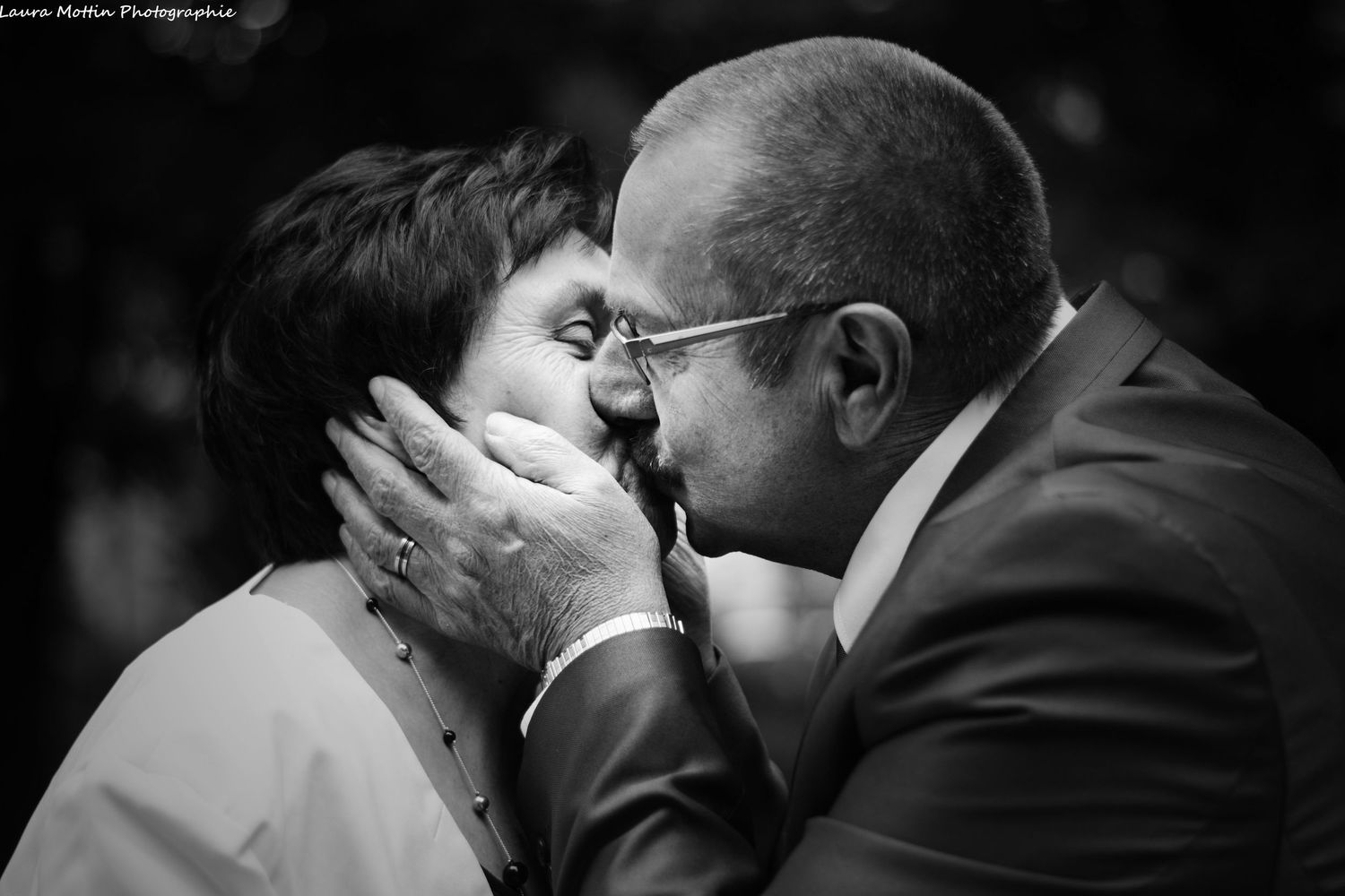 Black and white close-up photos capturing tender romantic moments between a couple.