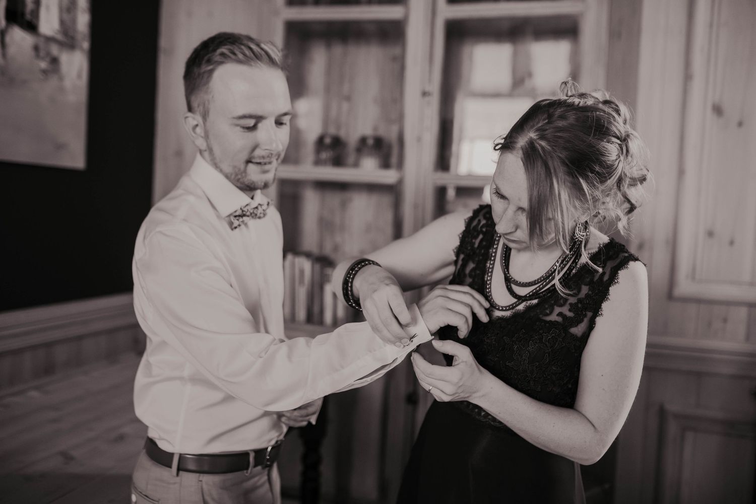 Black and white photos of playful dancing moments during wedding reception.