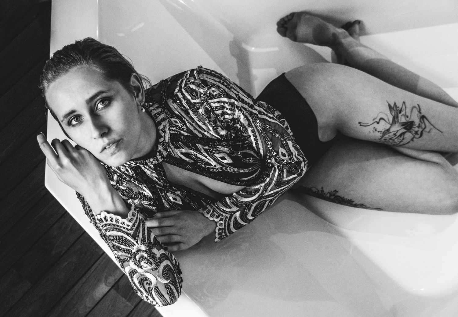 Monochrome fashion series showing a model reclining in various elegant poses.