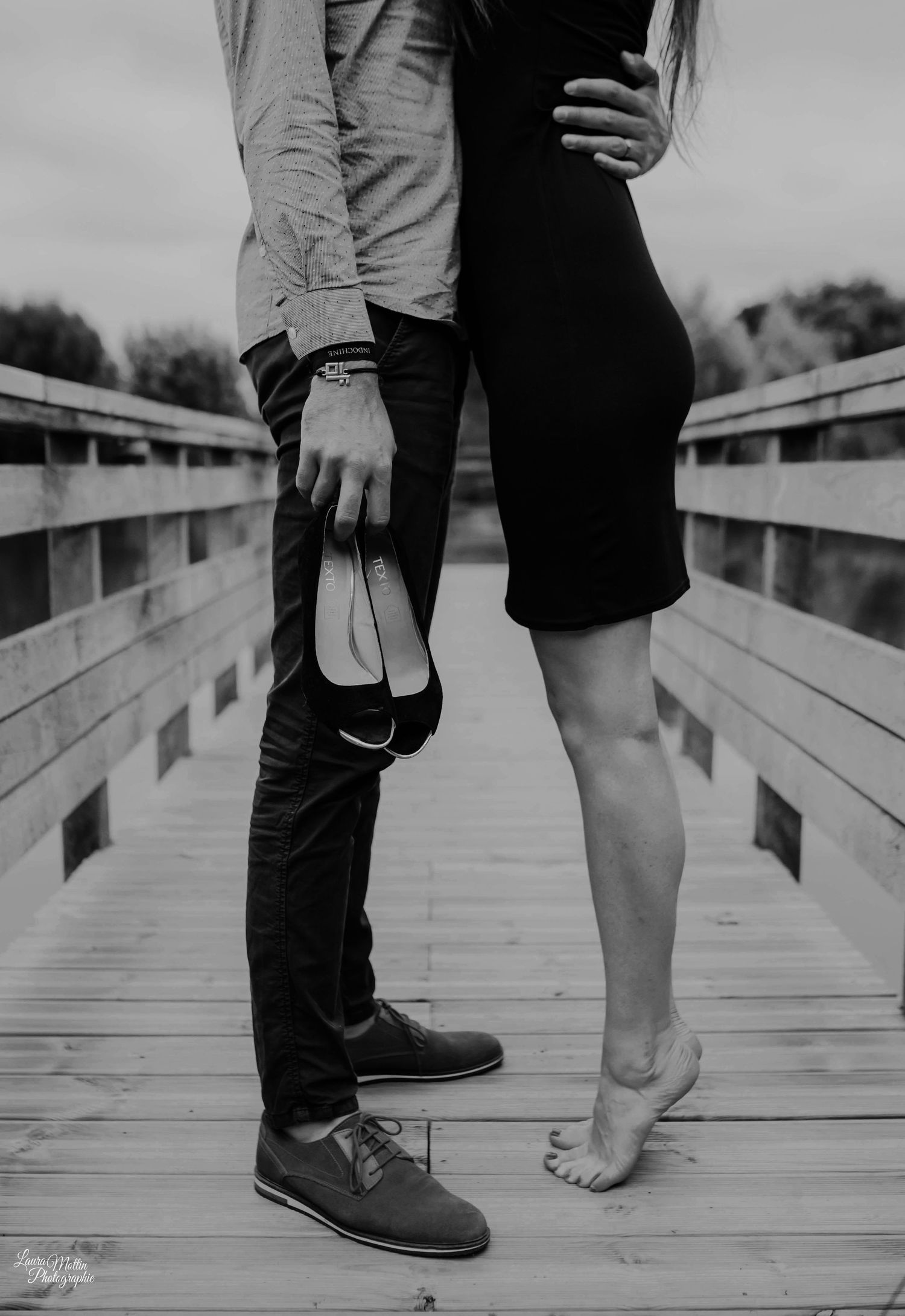 Black and white photos showing couple's feet and legs standing close together on a wooden boardwalk.
