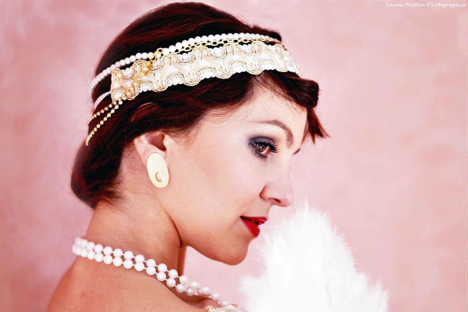 Vintage-inspired boudoir portrait series in soft pink tones with pearl accessories.
