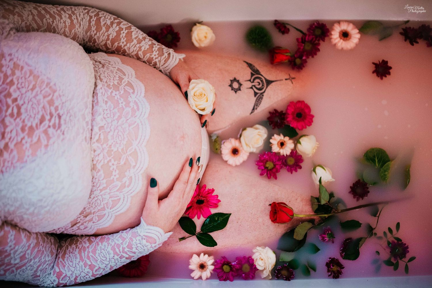 Delicate pink floral decorations arranged artistically against a soft pink background.