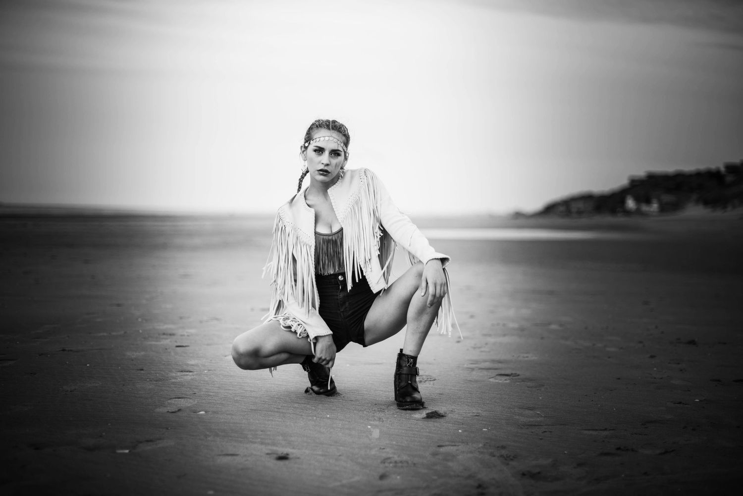Black and white sequence showing low crouching poses on minimalist horizon.
