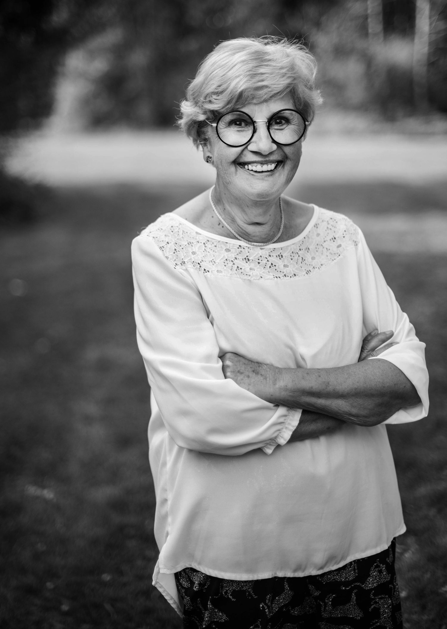 Black and white series showing joyful expressions and laughter in an outdoor setting.