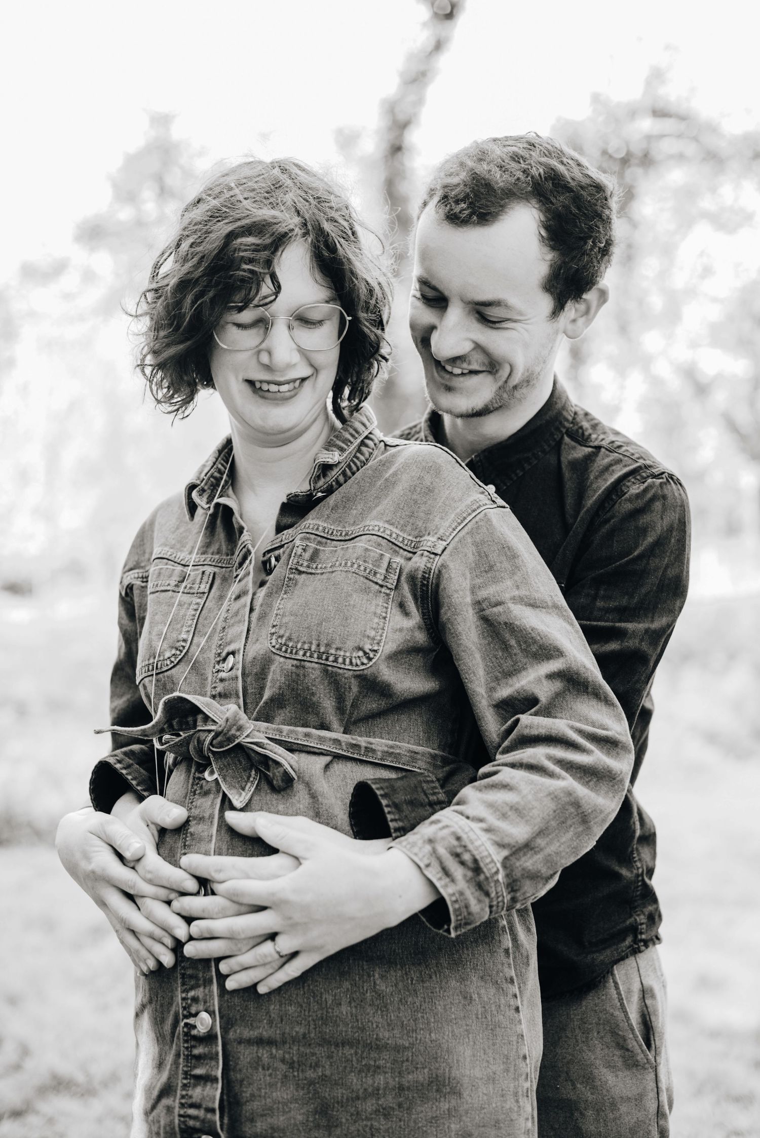 Black and white maternity photography series showing tender moments.