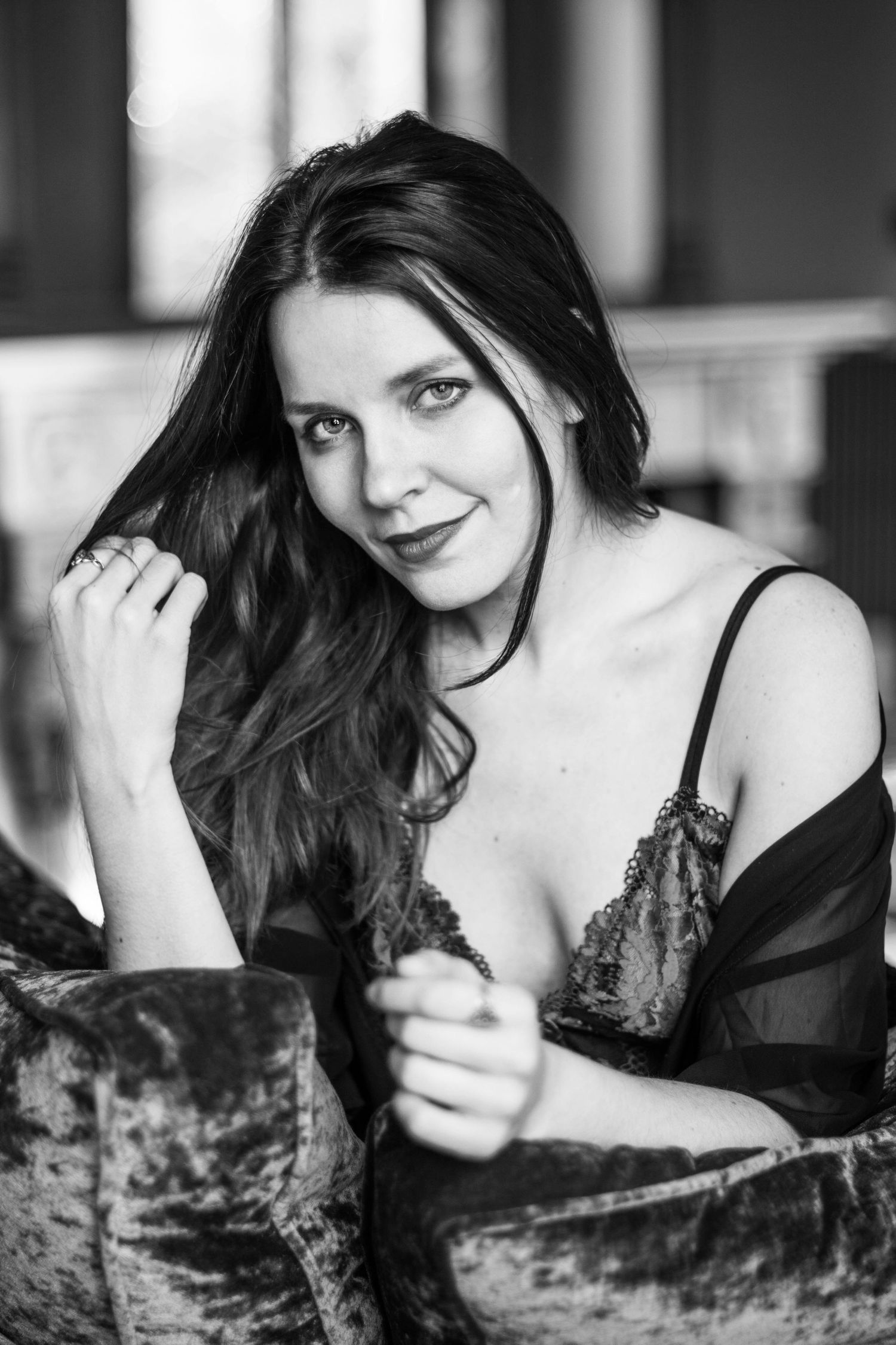 Dramatic black and white boudoir portraits with vintage aesthetic.