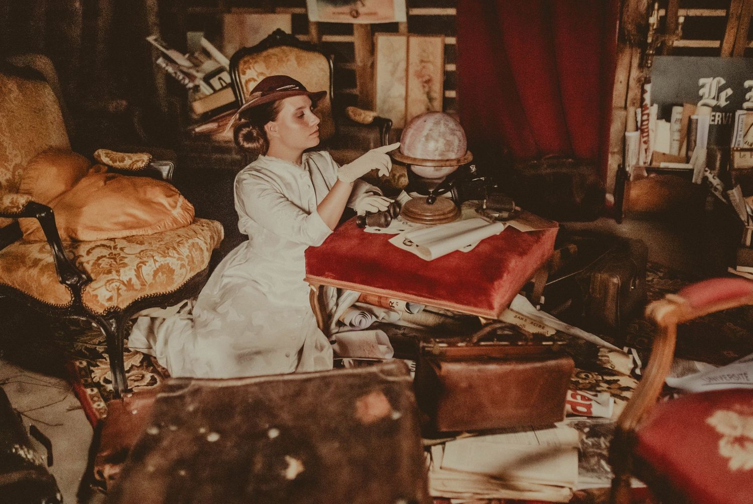 Sepia-toned vintage photography setup with antique books and props.