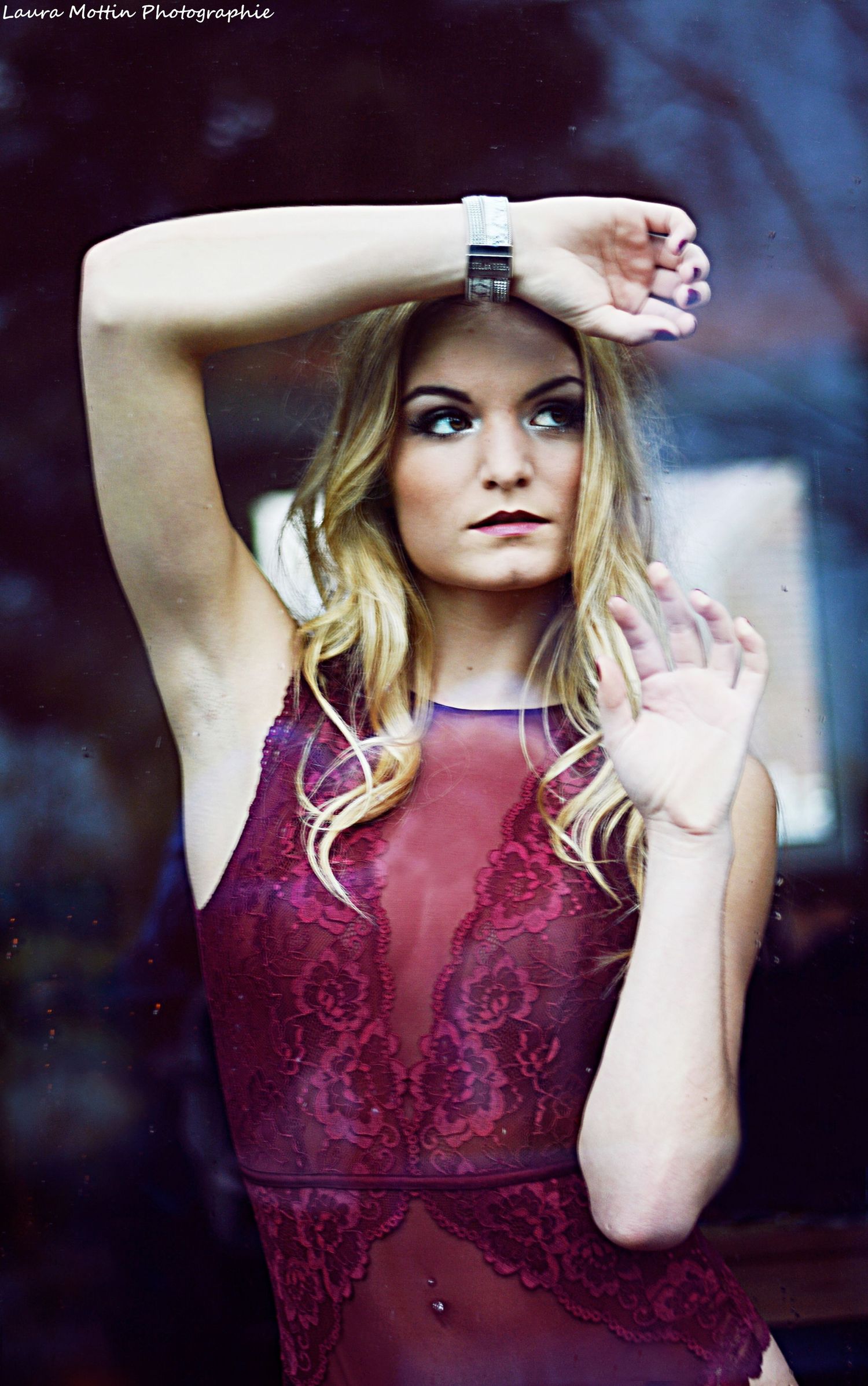 Fashion portraits in a burgundy lace dress with dramatic lighting and poses.