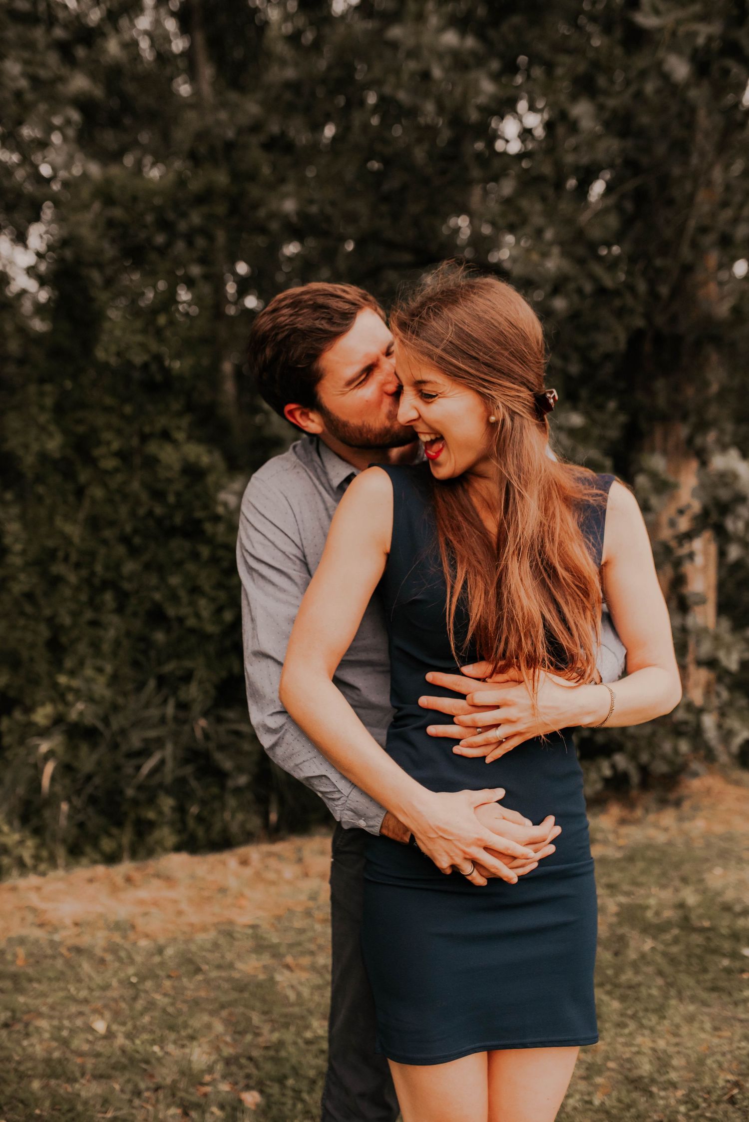 Romantic couple photos showing intimate moments outdoors in natural lighting.