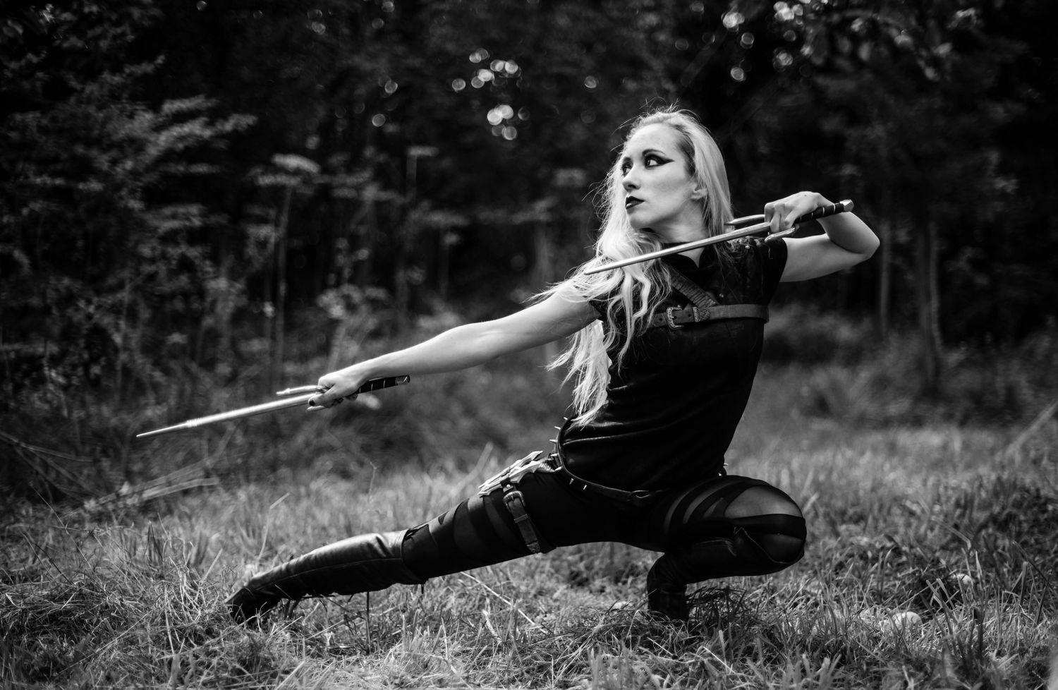Black and white photo series showing dynamic sword movements in an outdoor setting.