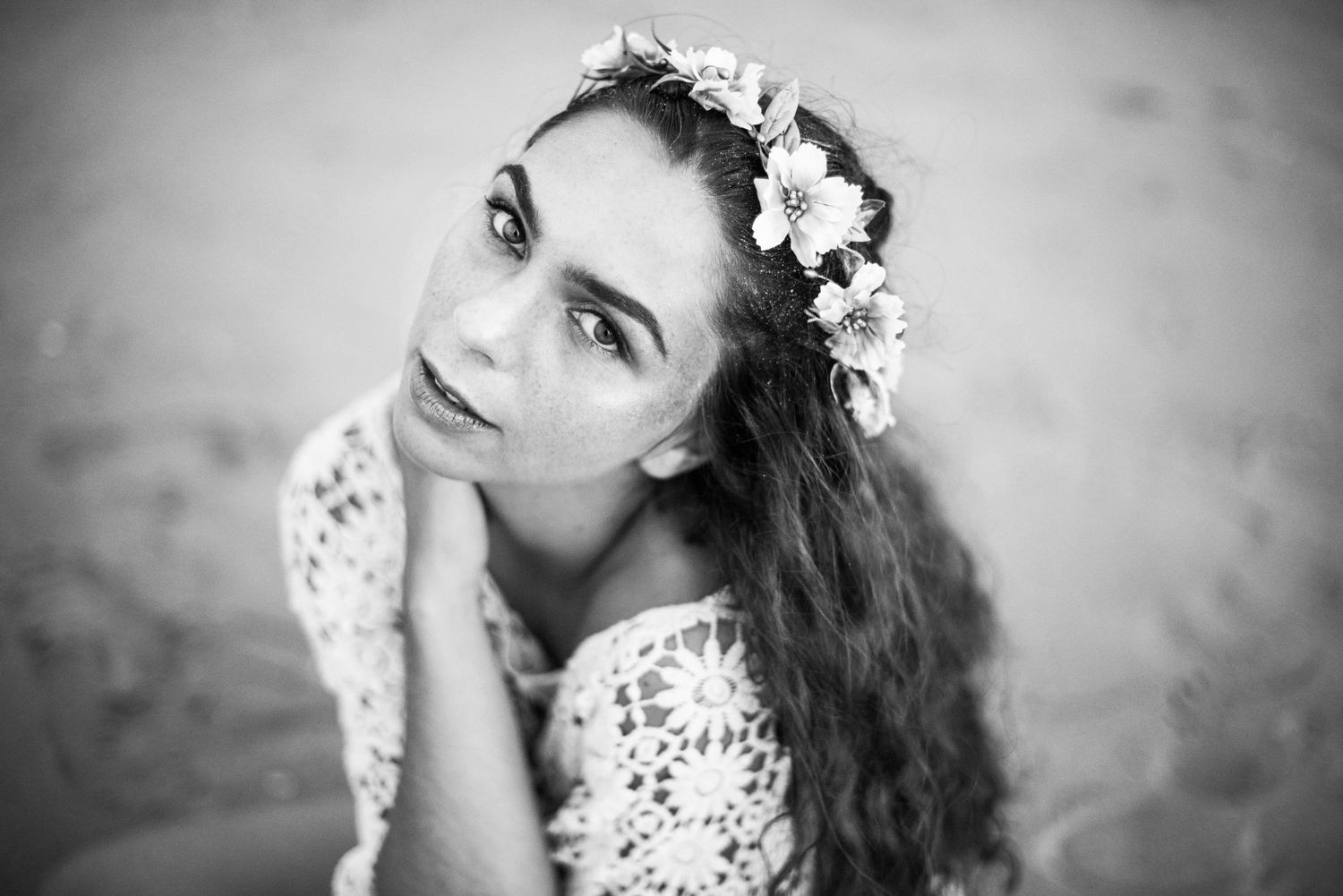 Black and white portraits with floral crown showing ethereal feminine styling.