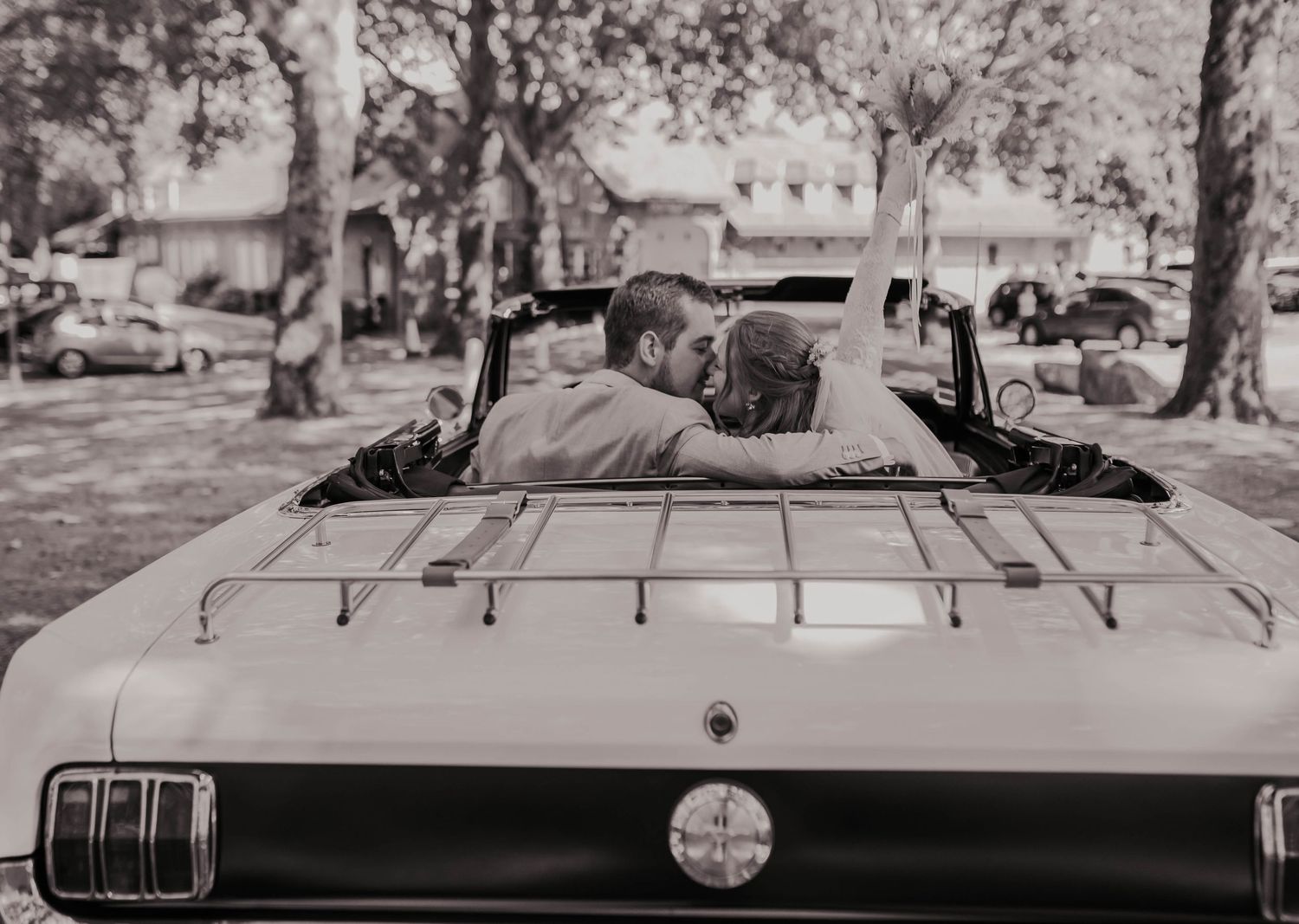Classic vintage car photographed in black and white from multiple angles.