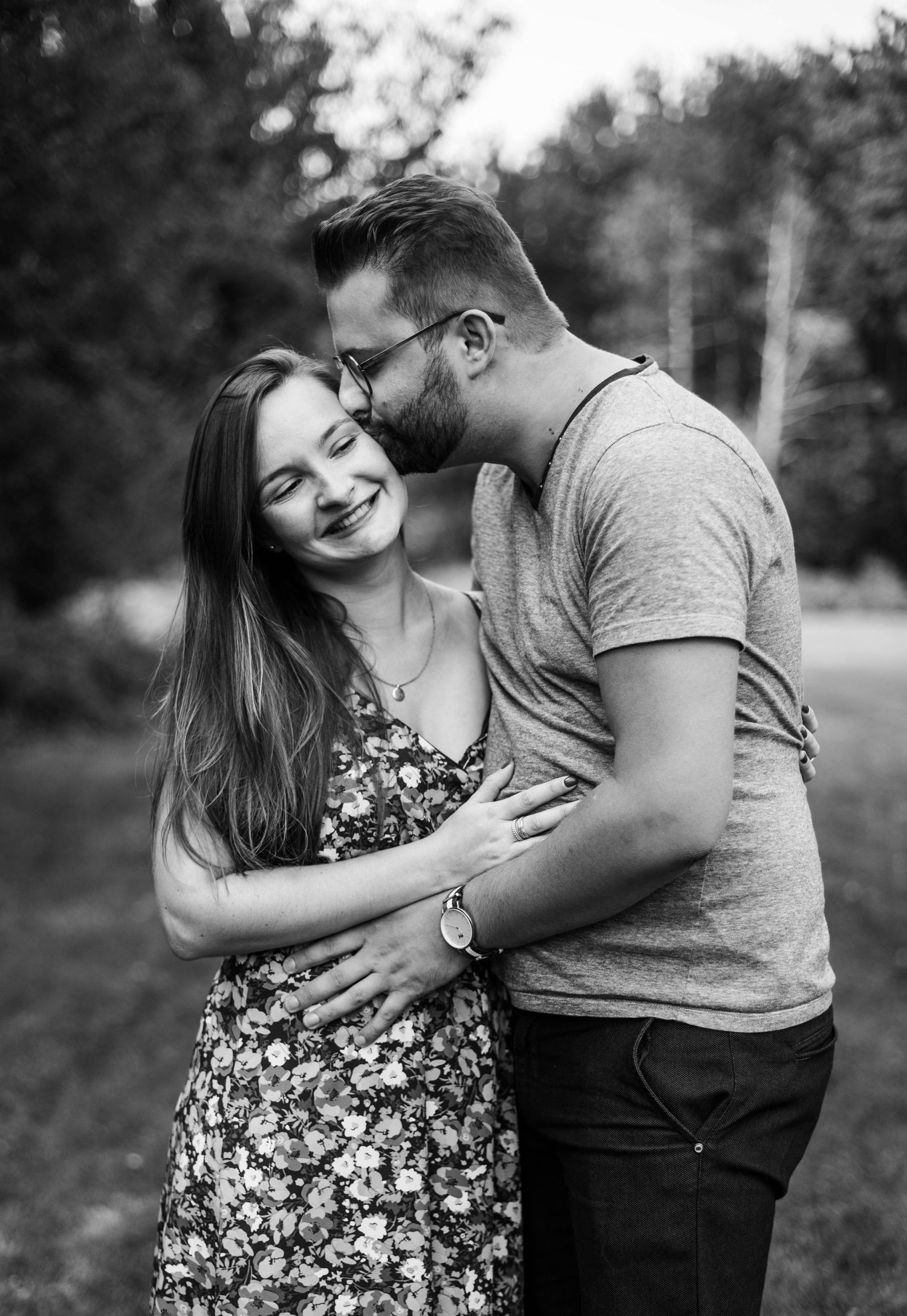 Romantic black and white couple photoshoot showing intimate moments and laughter.