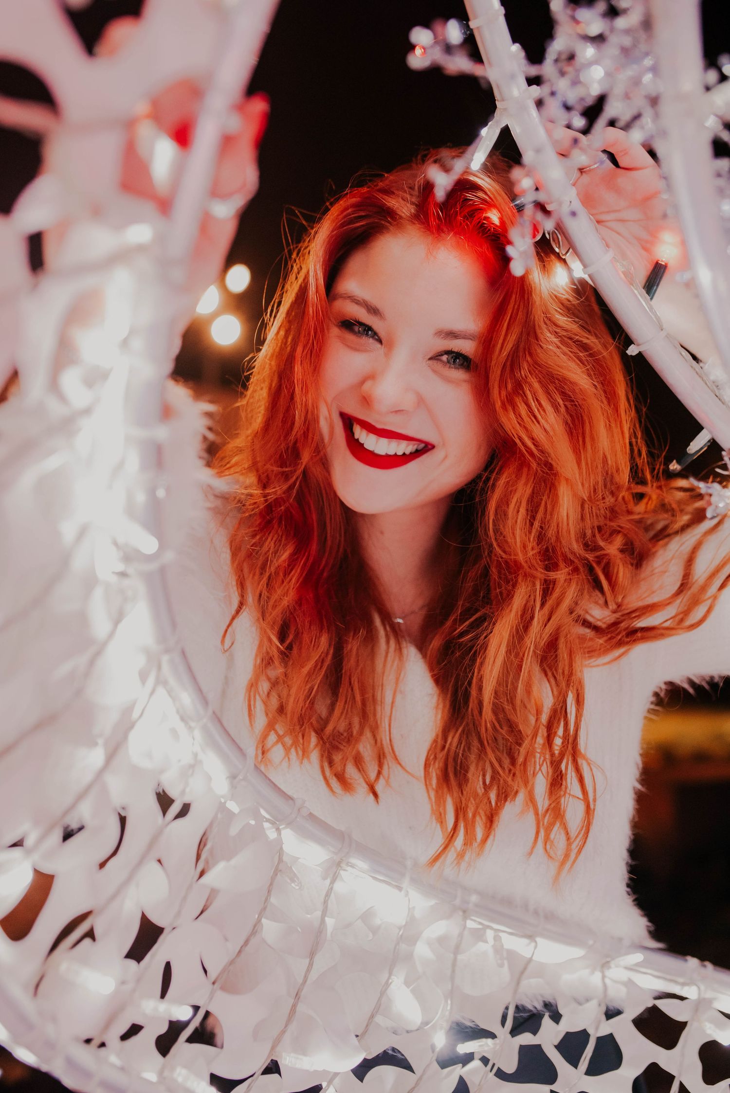 Artistic portrait with white confetti and soft lighting creating a dreamy atmosphere.