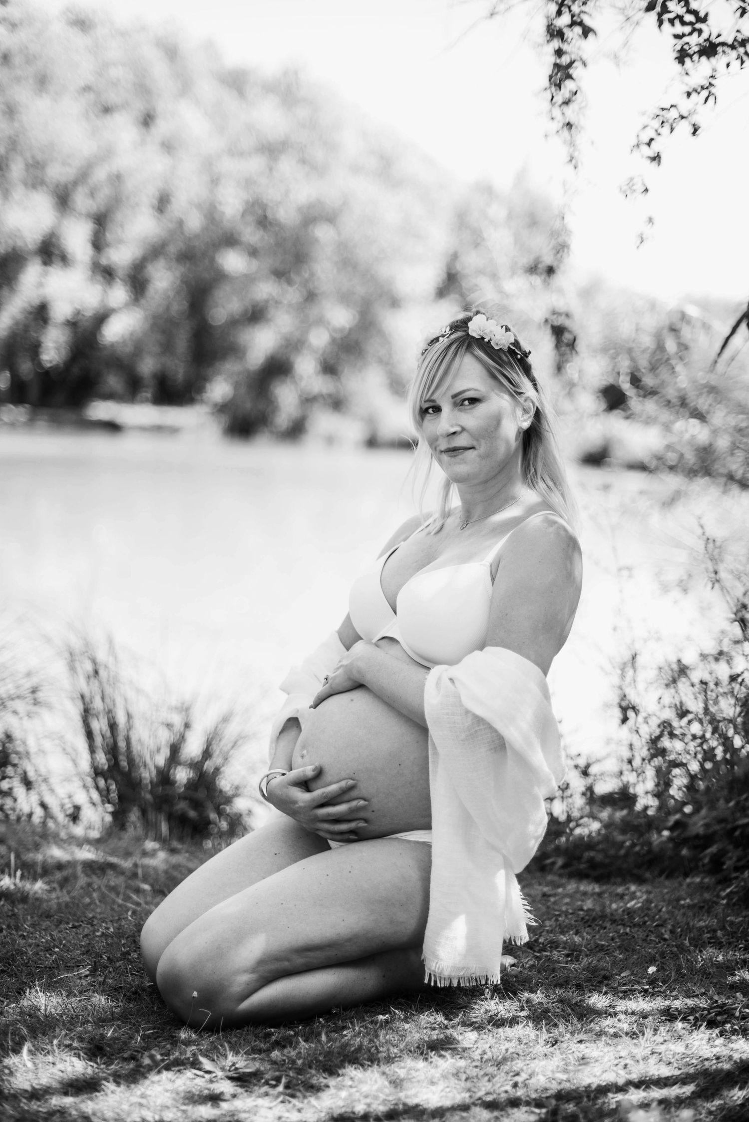 Artistic black and white maternity photos taken outdoors in natural lighting.