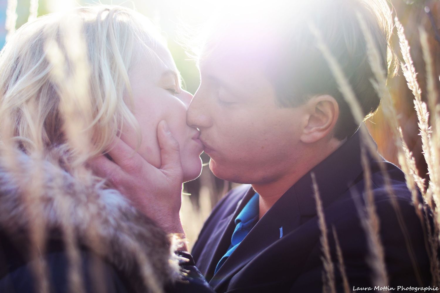 Soft focus romantic photos of a couple sharing intimate moments in glowing sunlight.