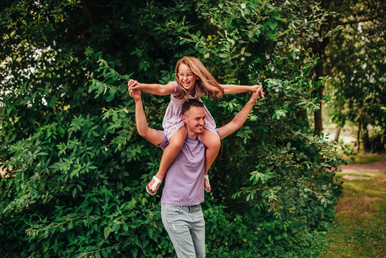 Playful outdoor family moments captured in a series of candid shots.