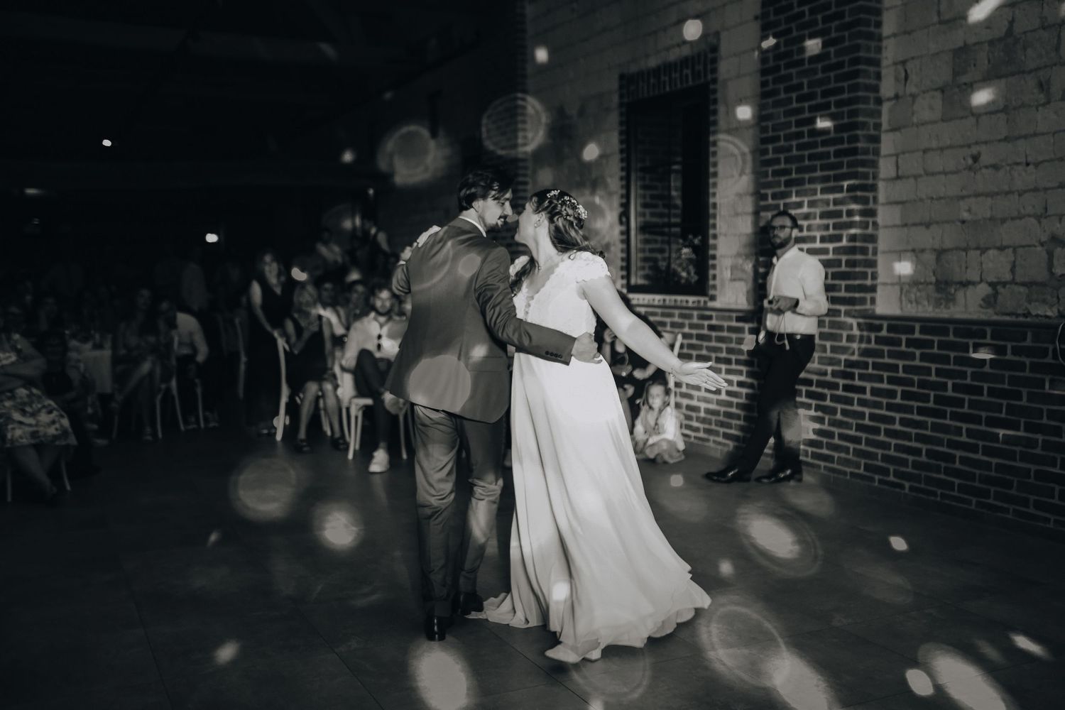 Black and white dance floor photos capturing joyful wedding reception moments.