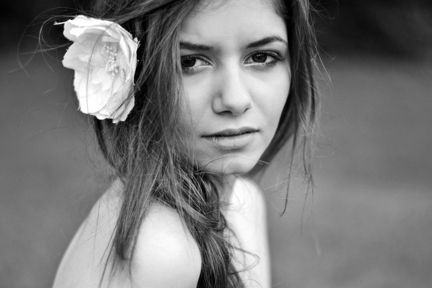 Black and white close-up portrait series with dramatic lighting.