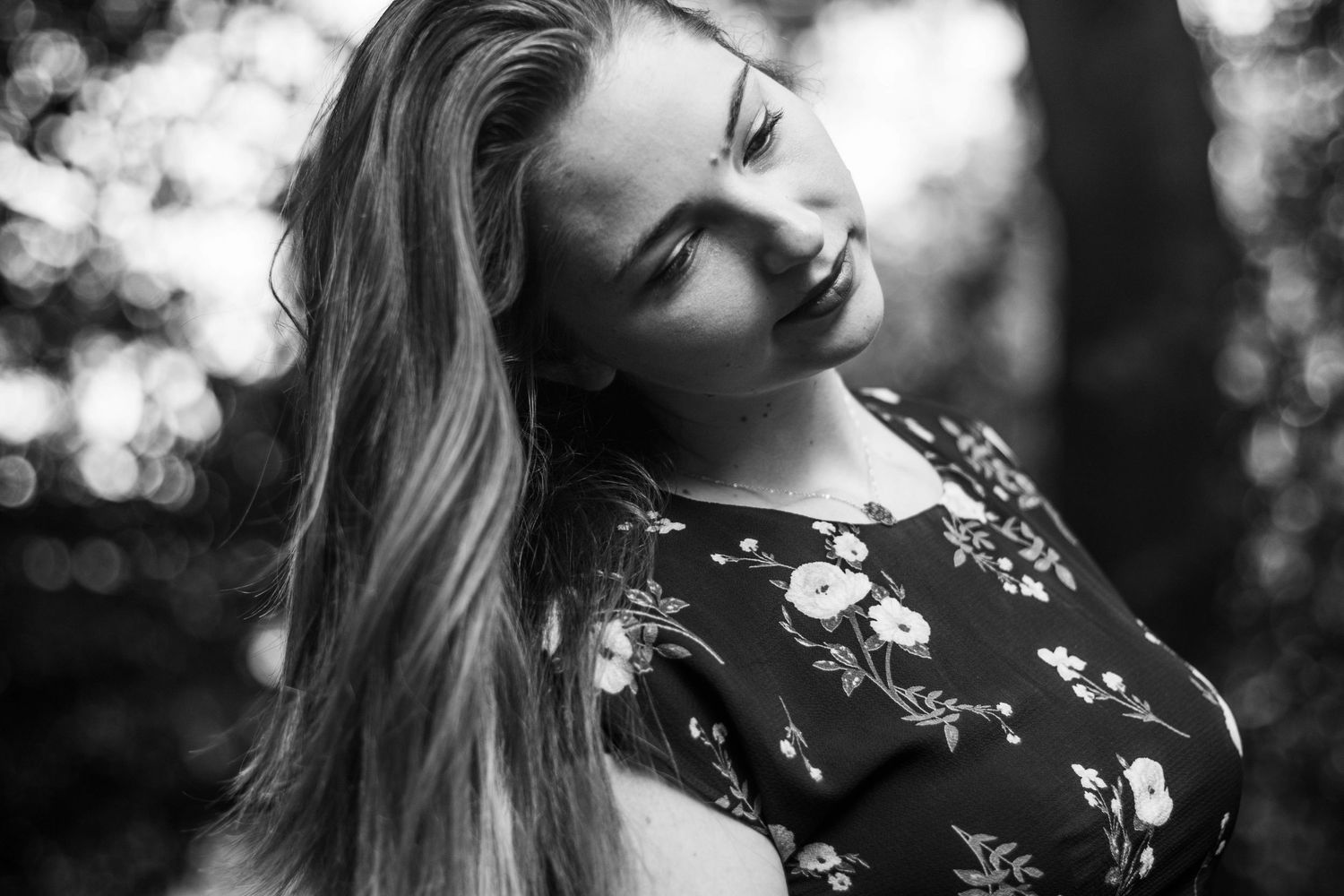 Black and white portrait series with soft focus and natural lighting effects.