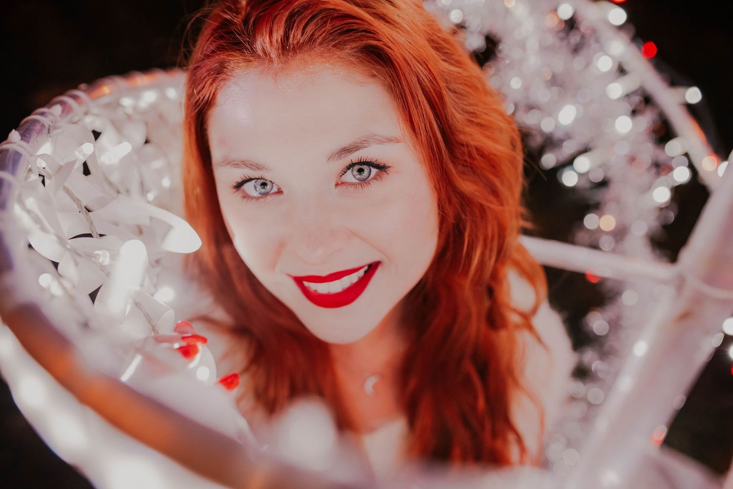 Ethereal portrait with white sparkles and soft focus creating a dreamy effect.