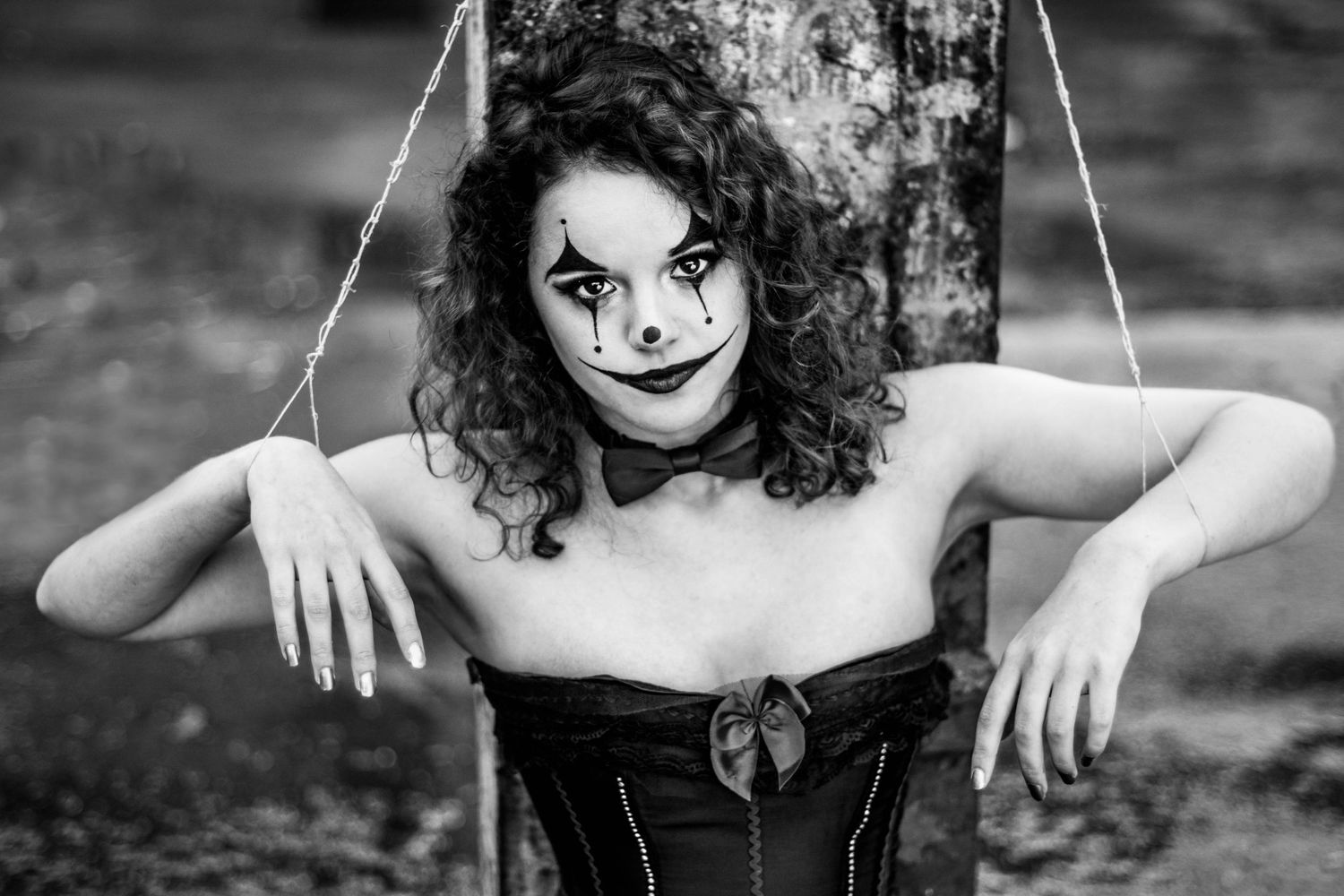 Black and white series showing expressive poses with dramatic clown makeup.