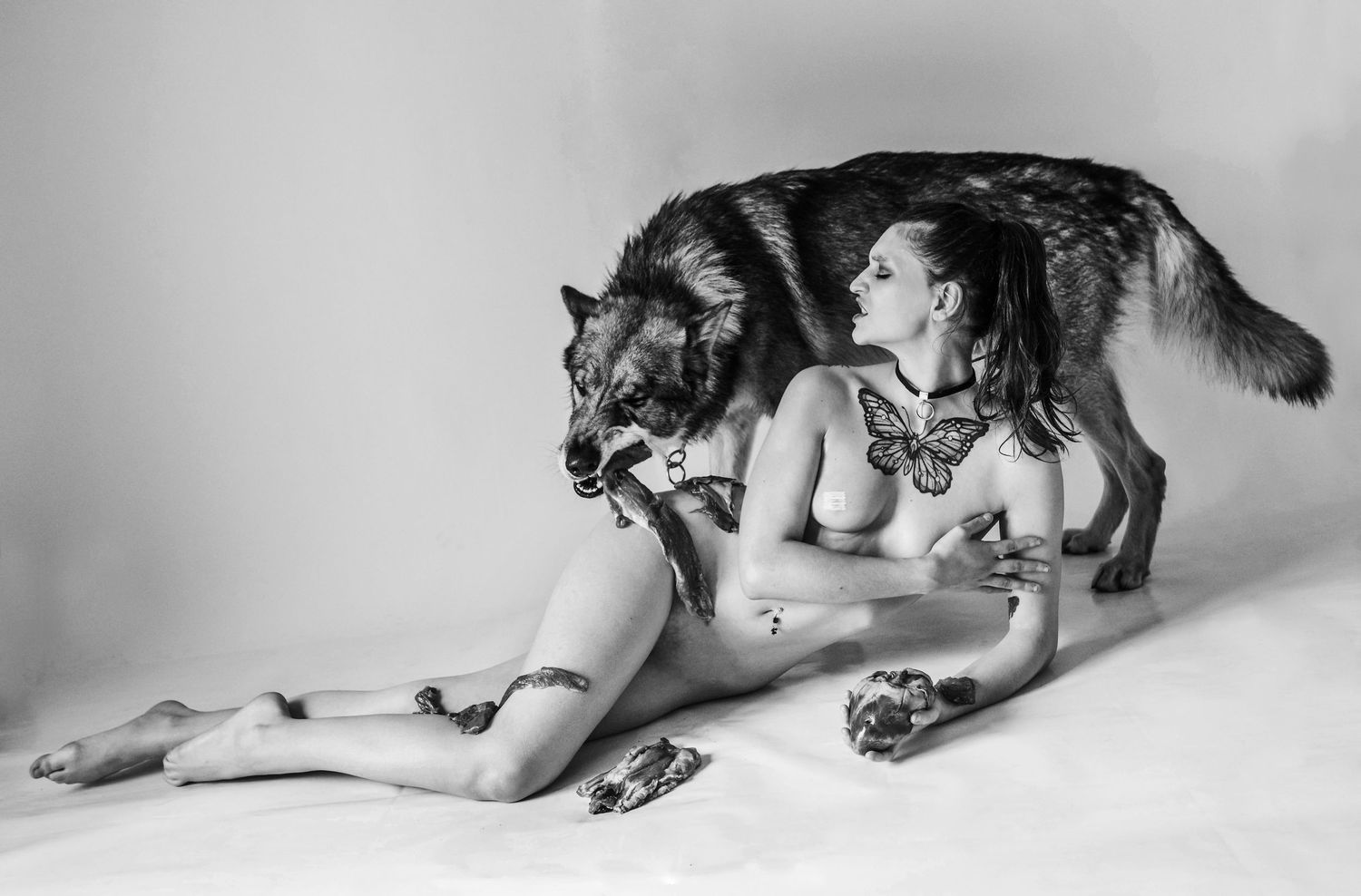 Artistic black and white series showing interaction between model and large canine.