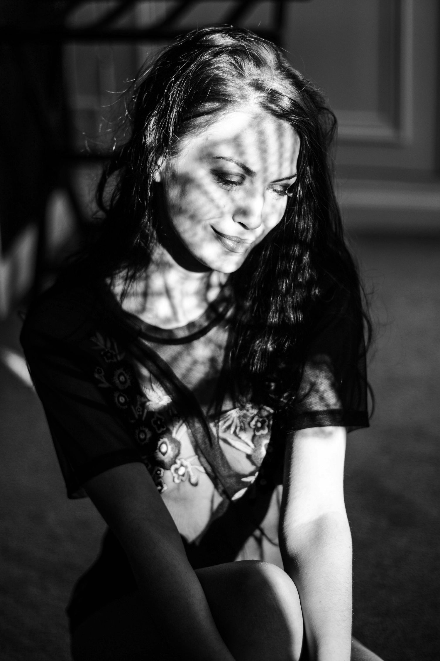 Artistic black and white portrait series with dramatic shadows and lighting effects.