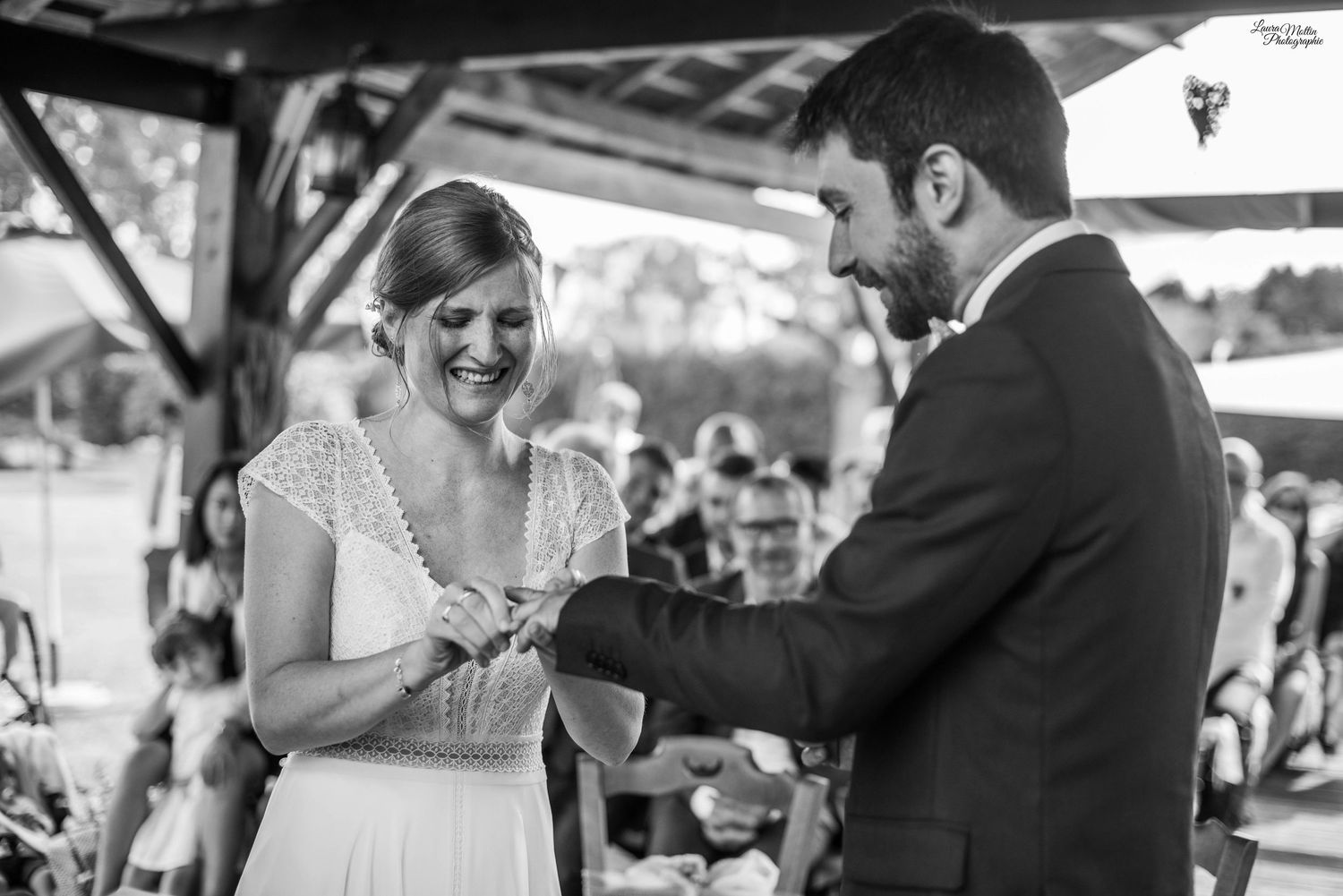 Wedding party celebrating during an outdoor reception with guests.