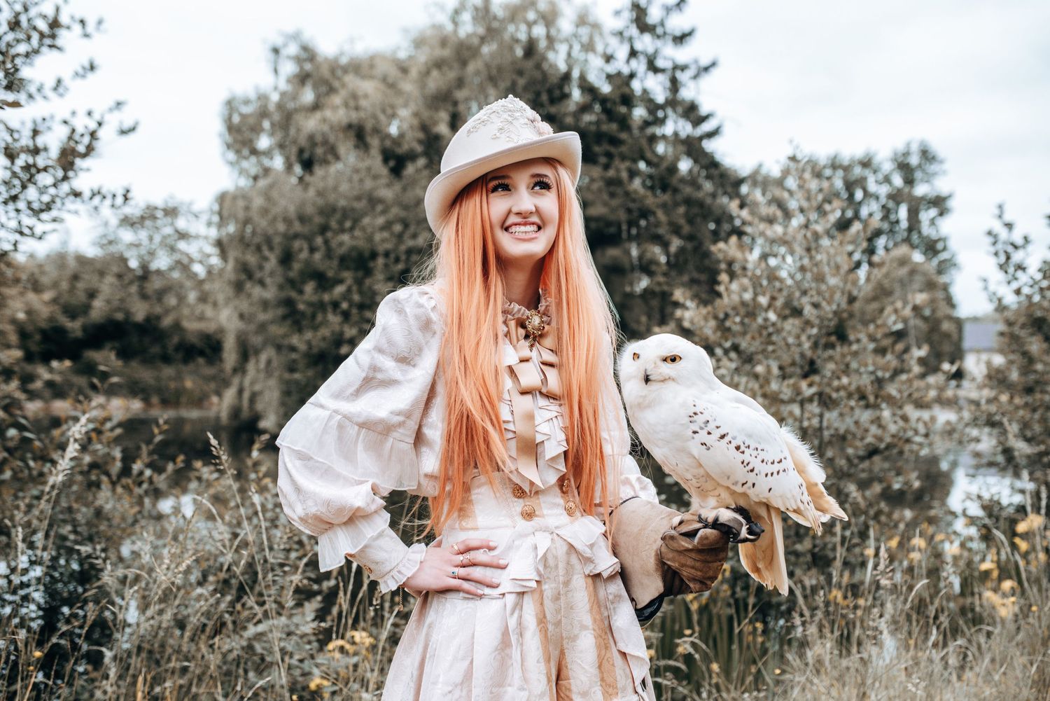 Whimsical outdoor portrait session featuring vintage-inspired white dress and natural scenery.