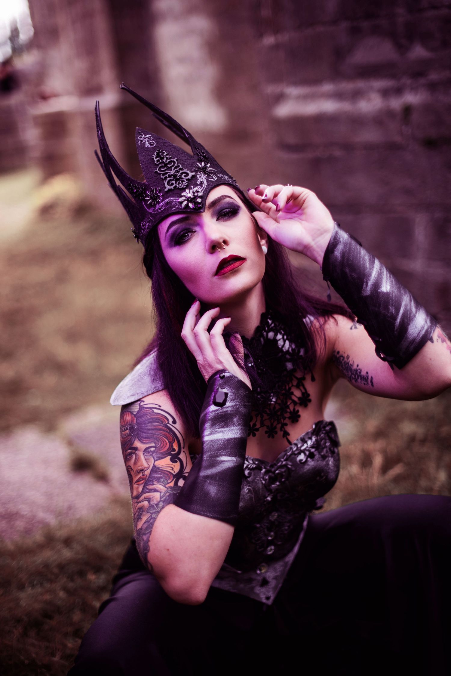 Gothic-inspired fashion photography with dramatic purple lighting and lace details.