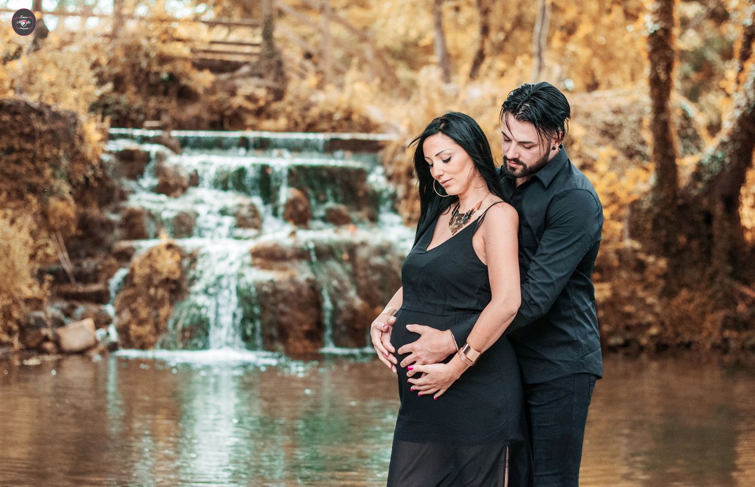 Series of romantic photos by a waterfall showing couple embracing during maternity shoot.