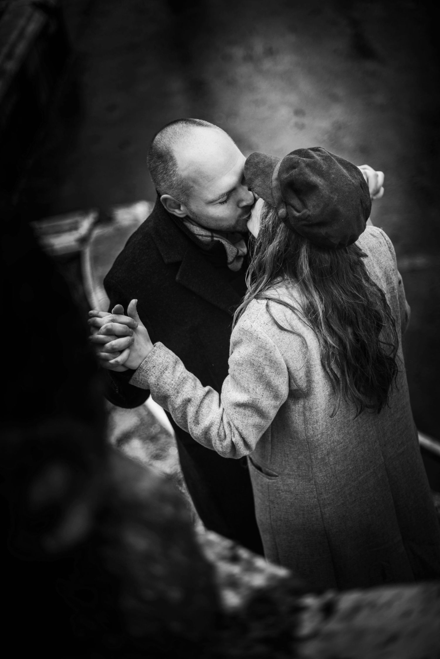 Black and white sequence showing tender embrace between two people.