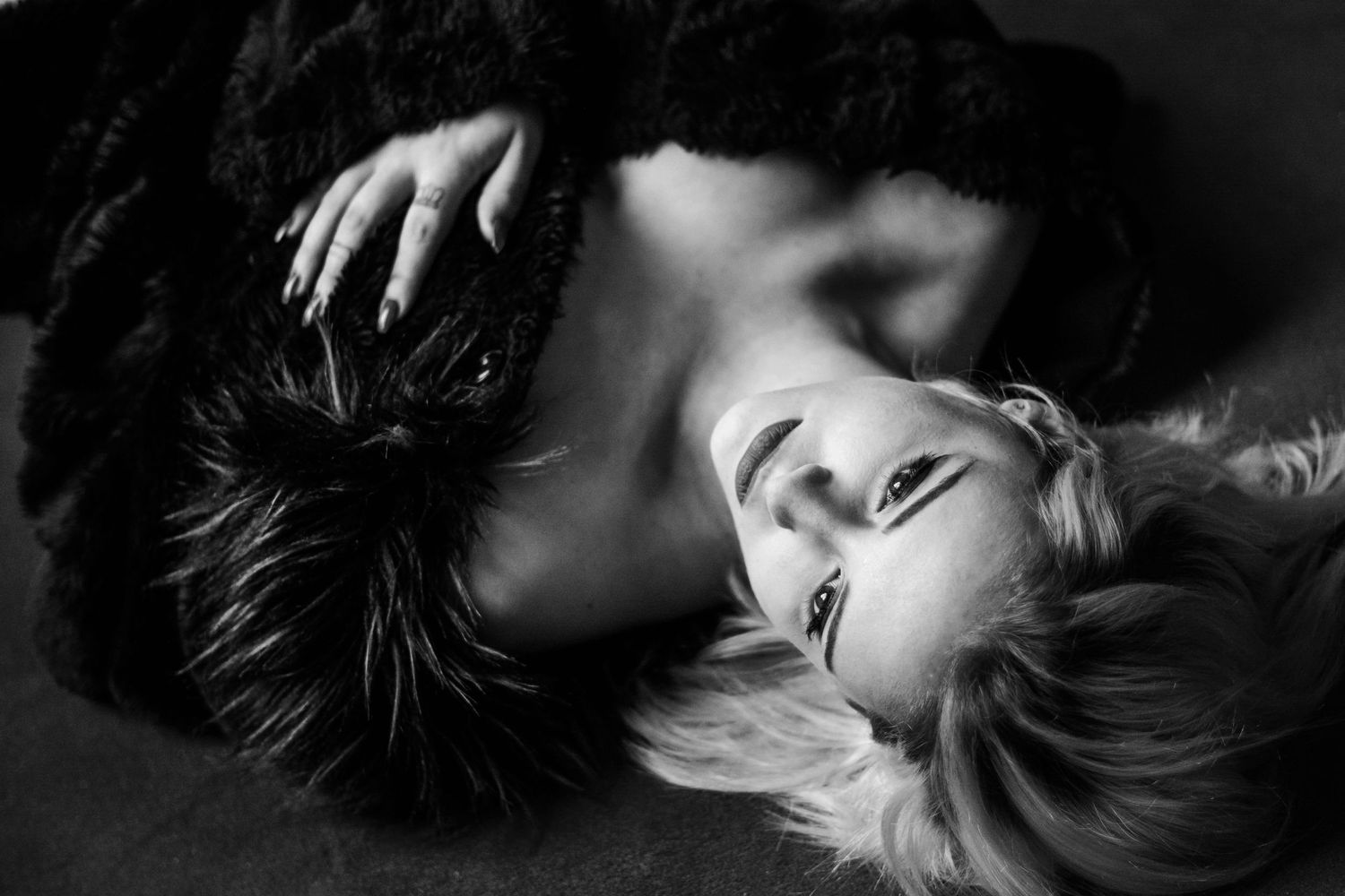 Dramatic black and white portrait series with moody lighting and shadows.