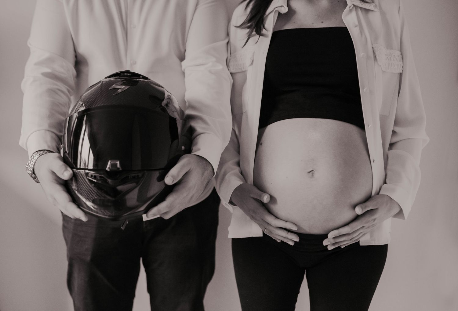 A series of black and white photos showing silhouettes of expecting parents.