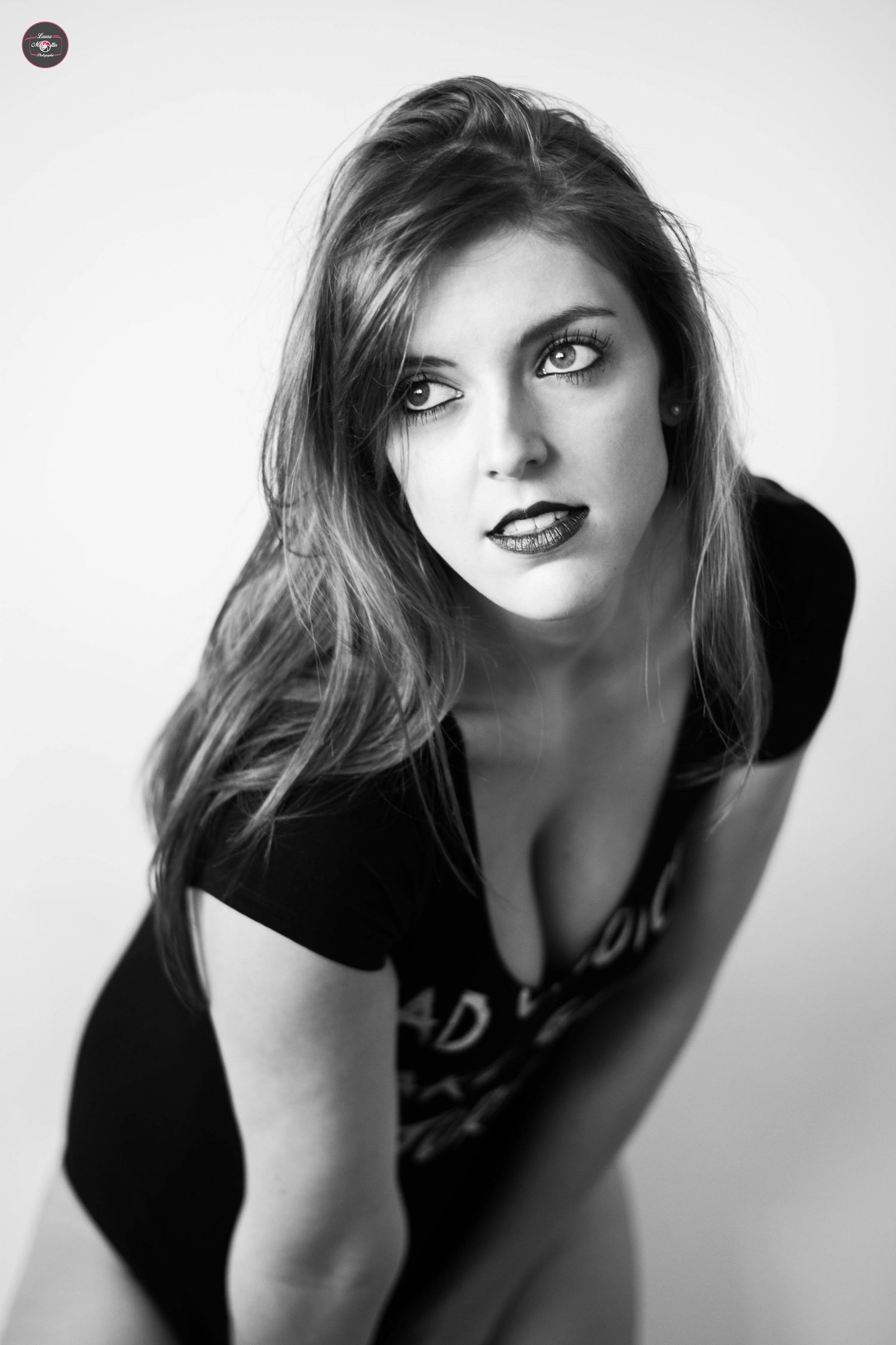 High contrast black and white glamour portraits with dramatic angles.