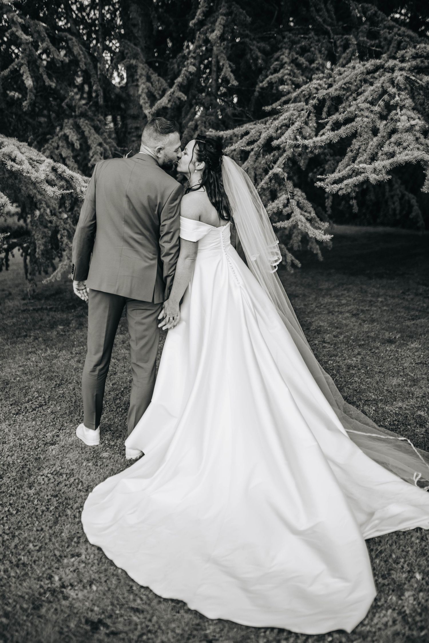 A sequence of romantic wedding photos showing a flowing white dress train against a natural outdoor backdrop.