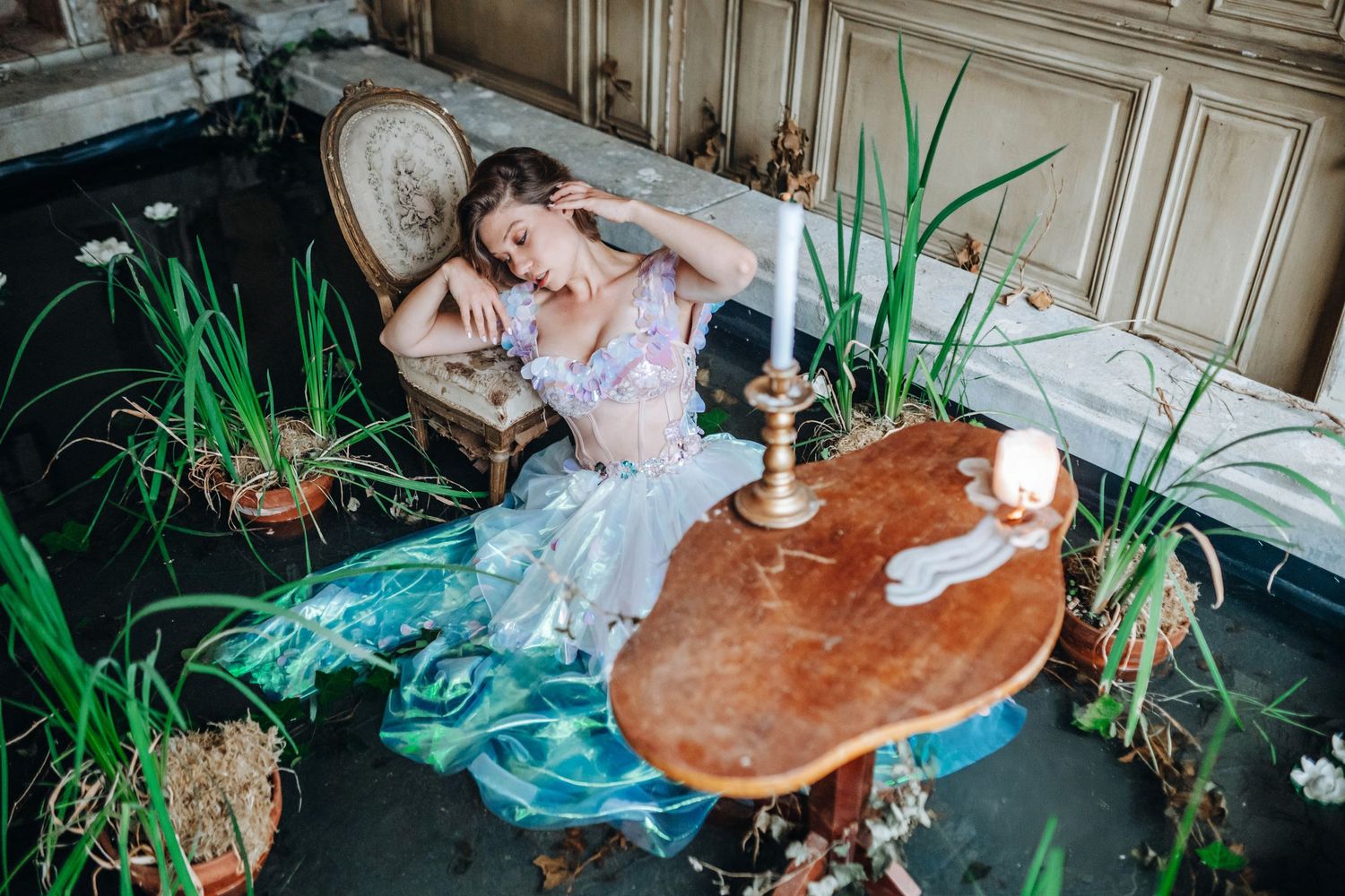 Dreamy boudoir scene with antique furniture and delicate white lace details.