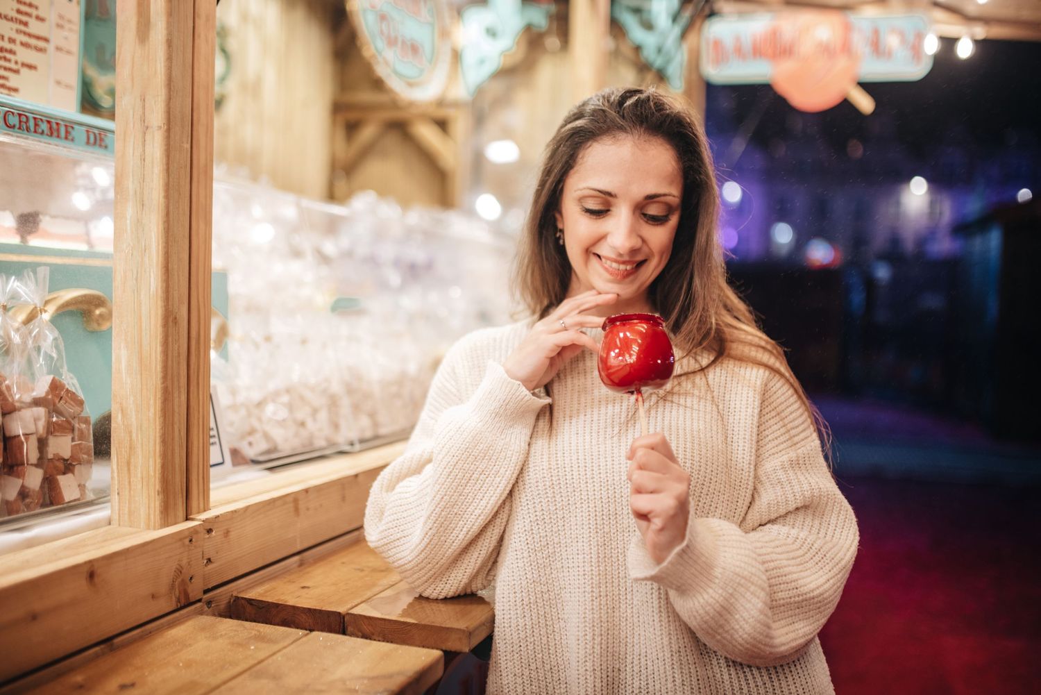 Playful scene at a carnival with warm lighting and rustic wooden details.