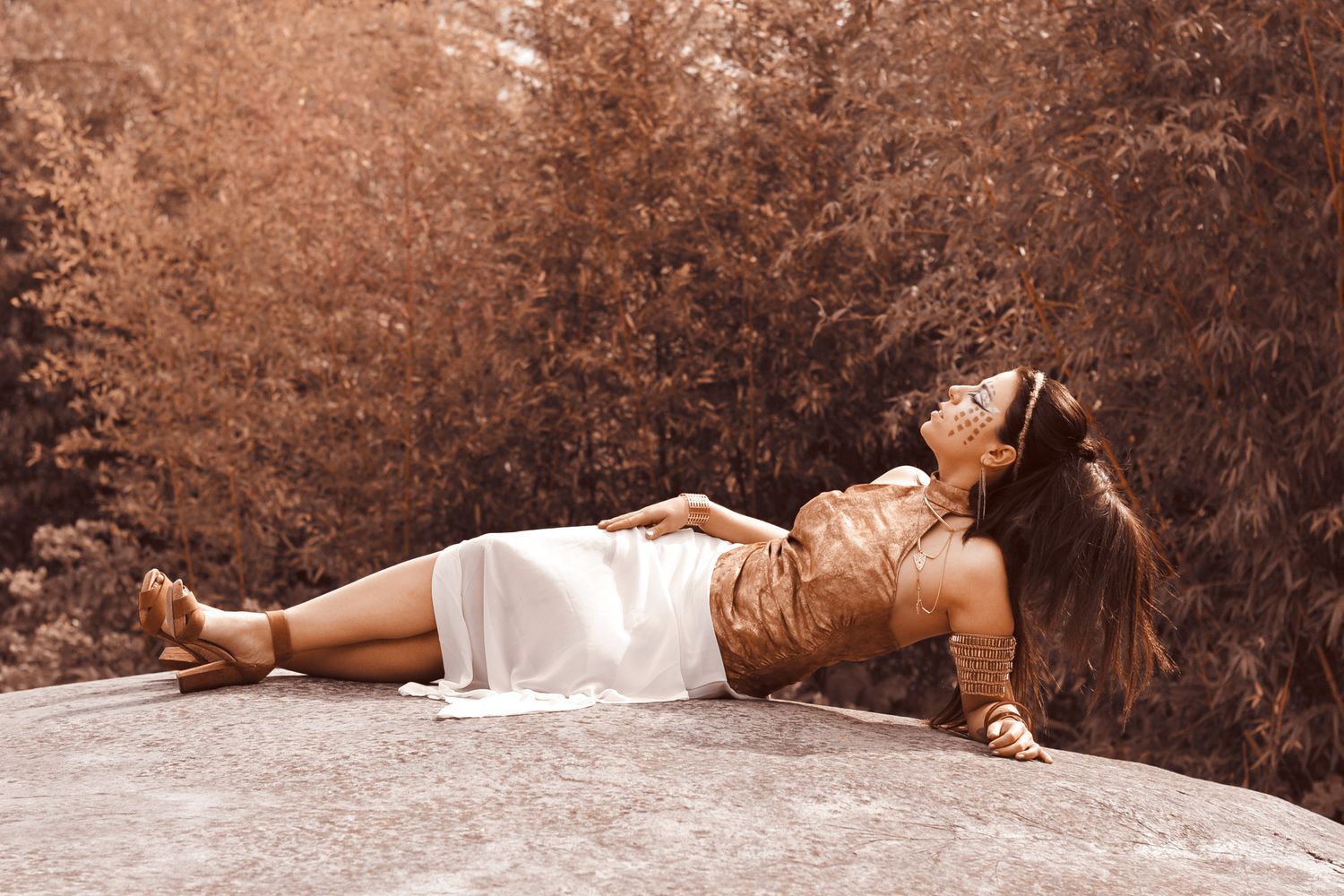 Sepia toned artistic portraits laid out in a sequence on textured background.