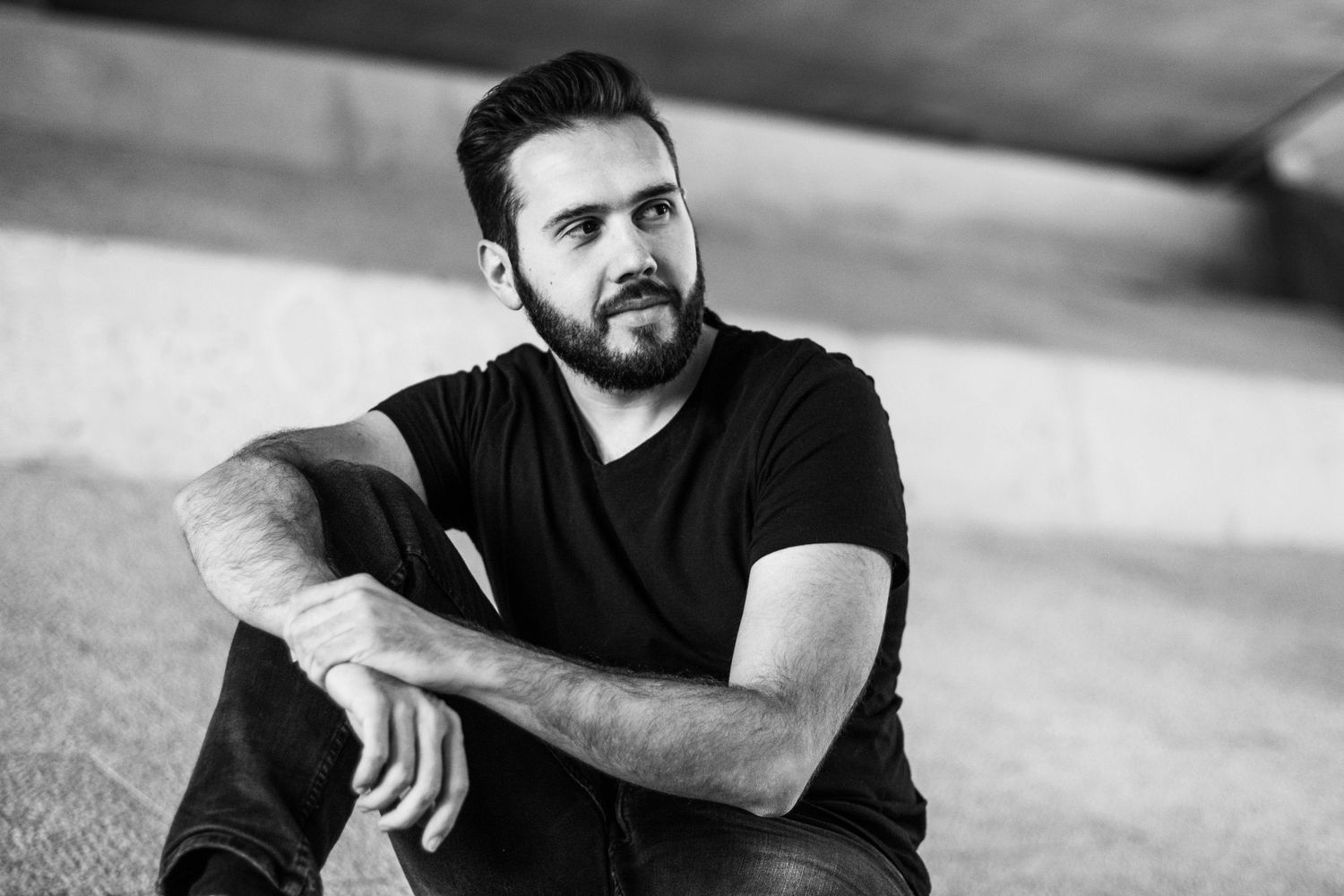 Artistic black and white portrait series showing dramatic lighting and shadows against a light background.