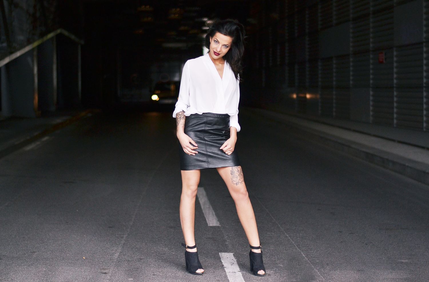 Urban nighttime fashion portraits showing street style against dark city backdrop.