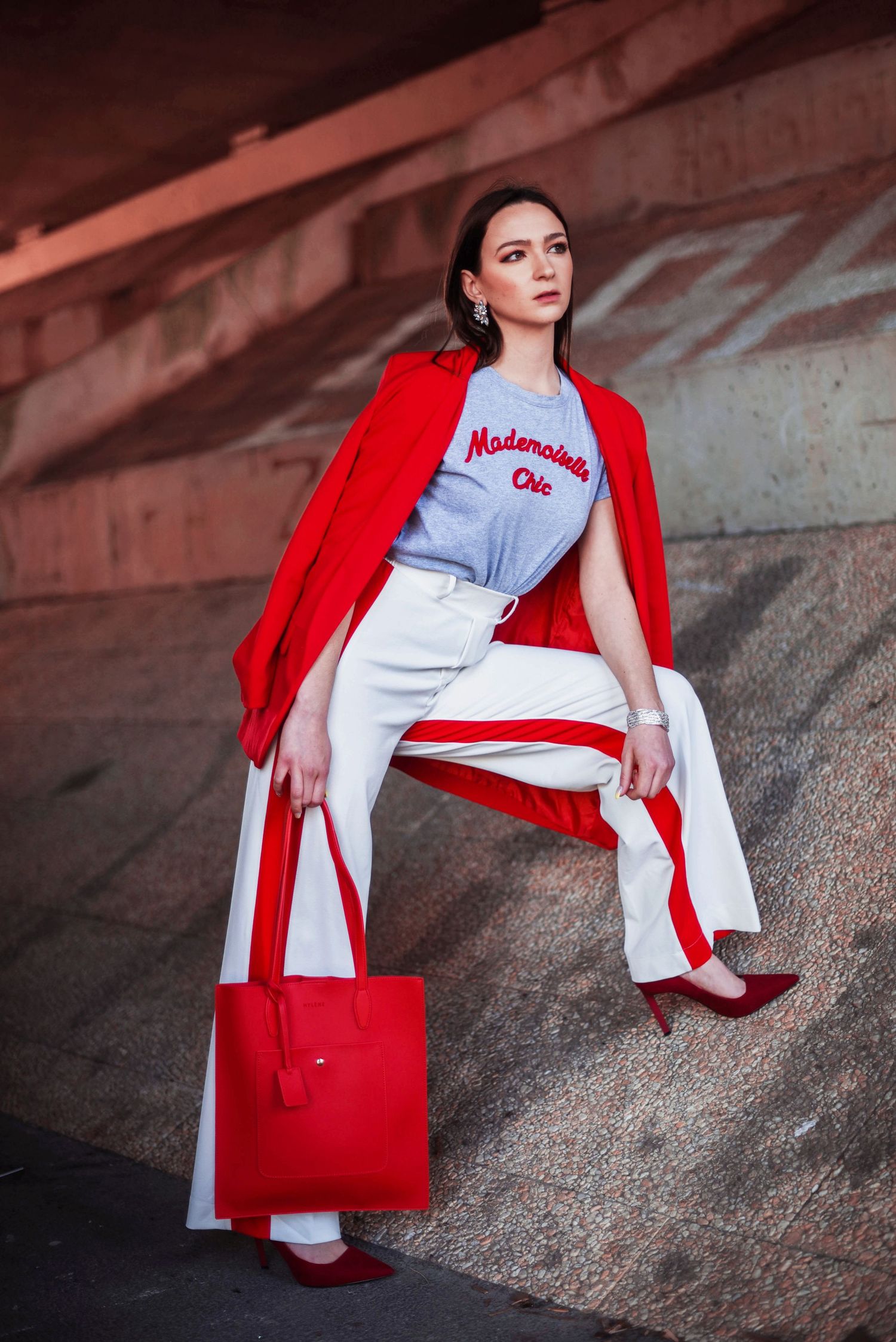 Casual street style photos with red blazer and graphic tee in urban setting.