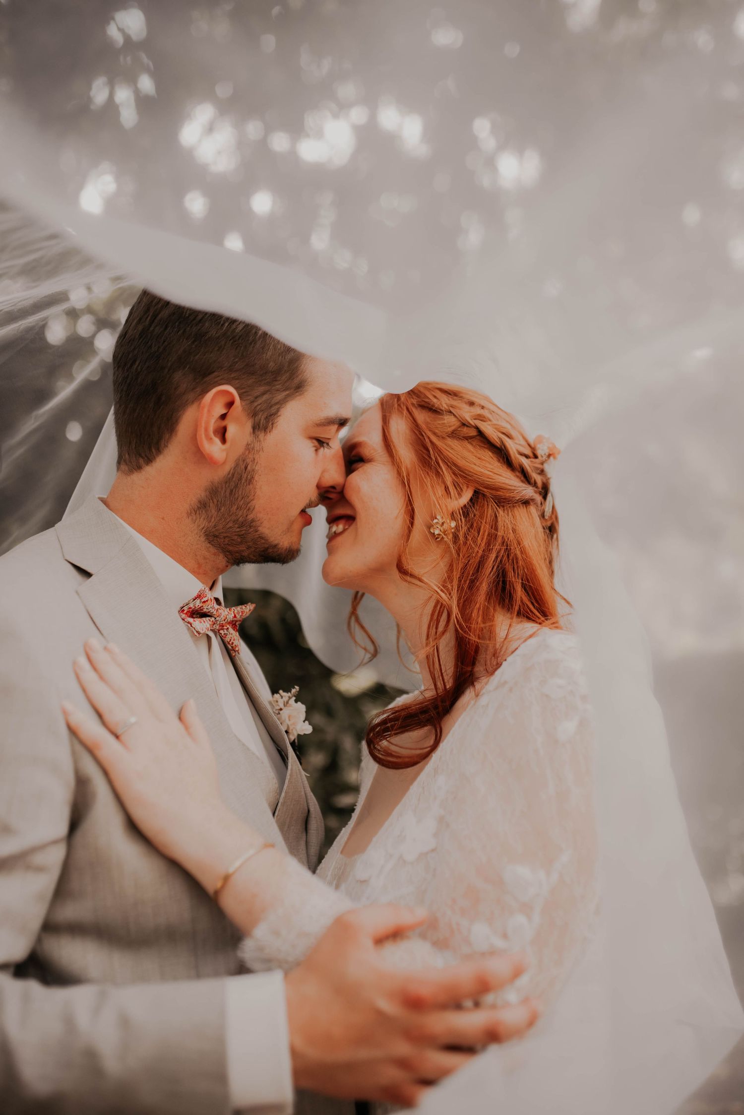 Intimate wedding portrait session with soft dreamy lighting and bokeh effects.