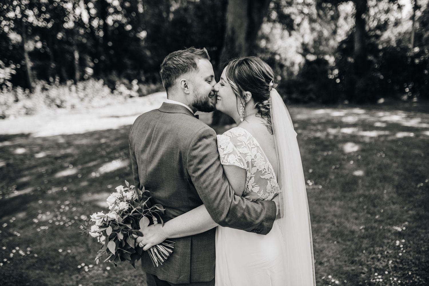 Black and white wedding photography sequence showing tender moments between newlyweds.