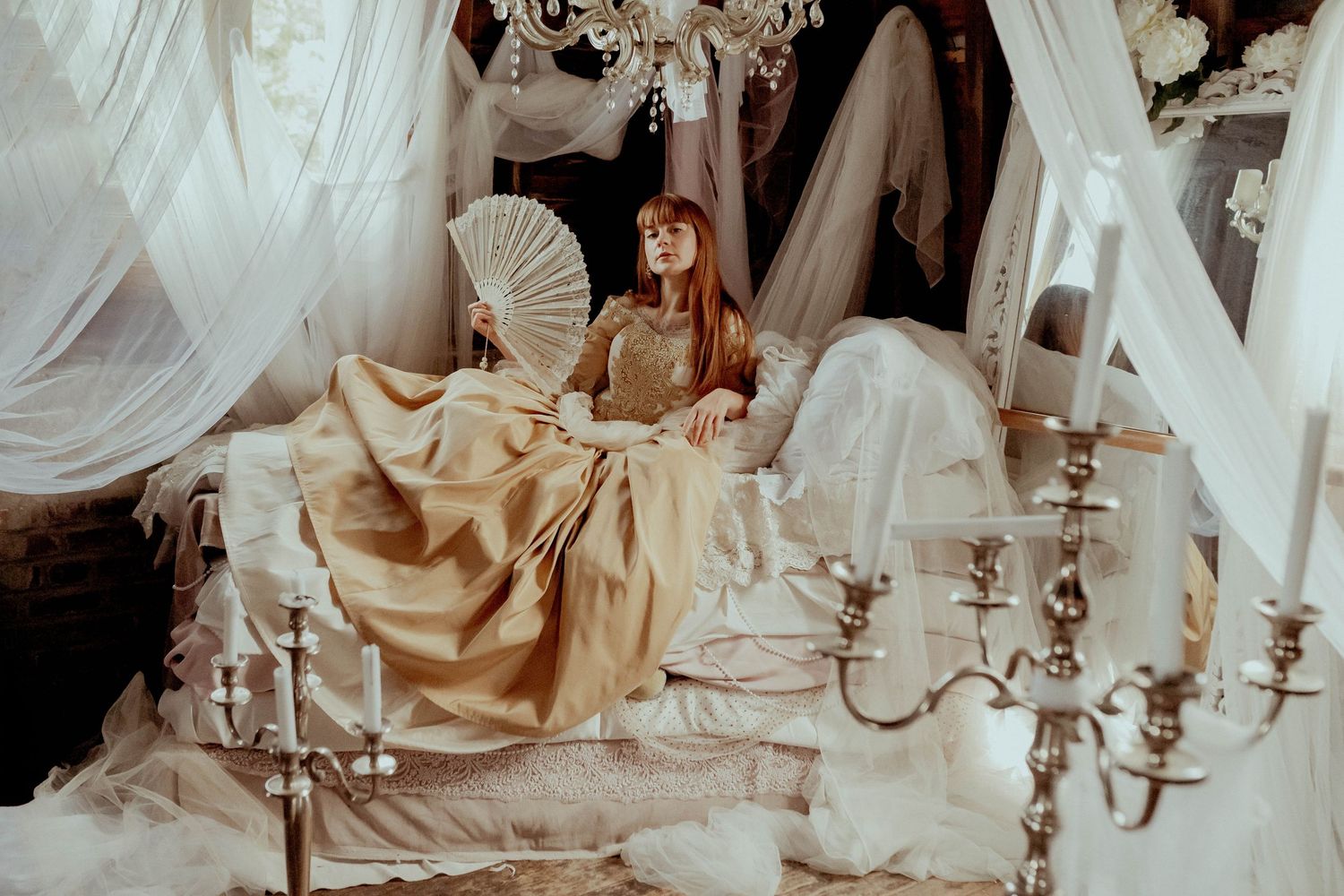 Dreamy vintage scene with candelabras and flowing fabrics in sepia tones.
