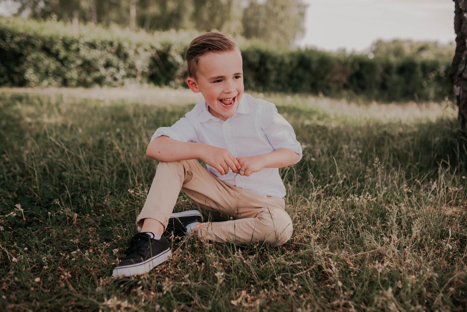 Candid family interactions photographed in a sunny outdoor setting.