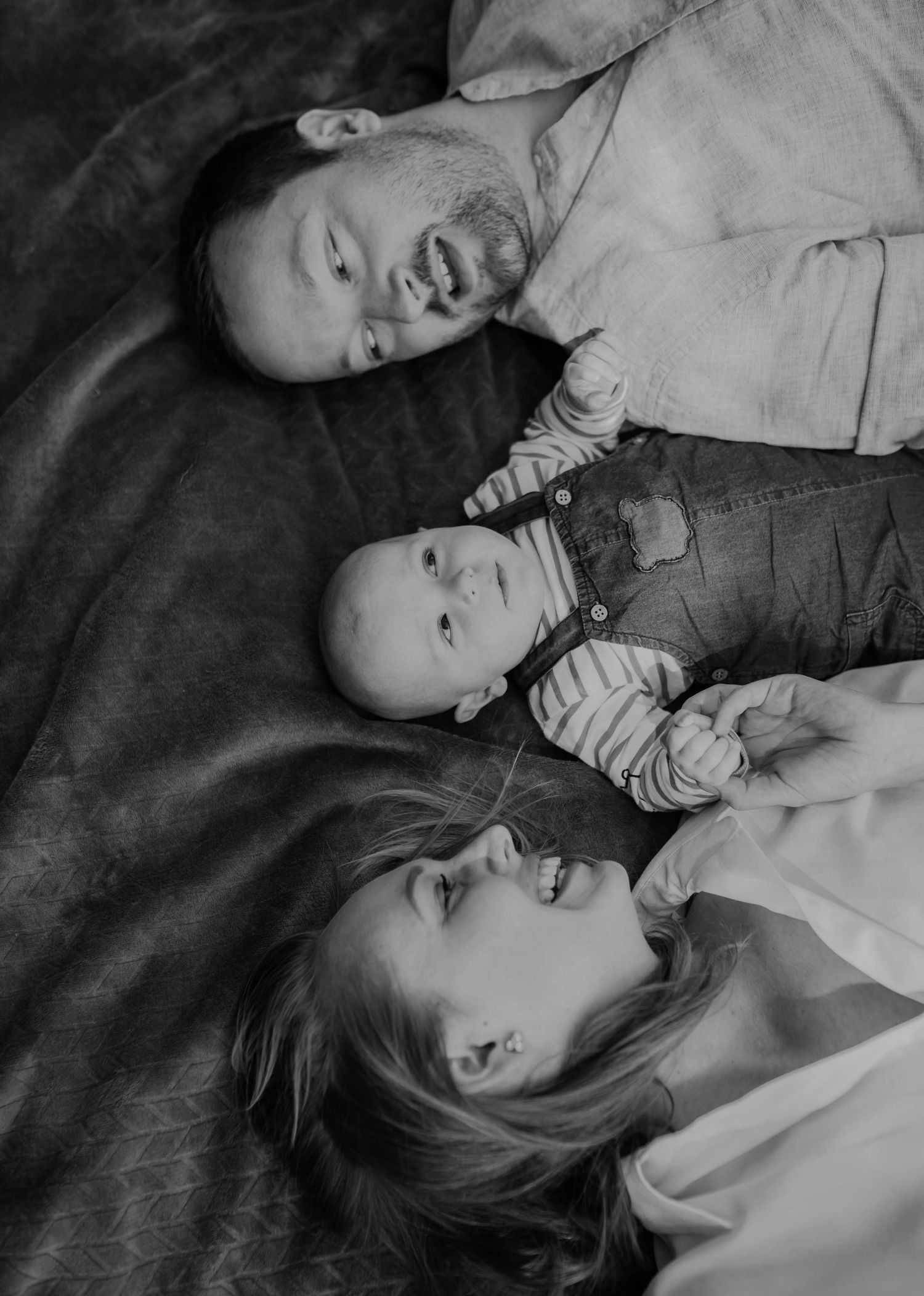 Black and white intimate lifestyle portraits on a light background.
