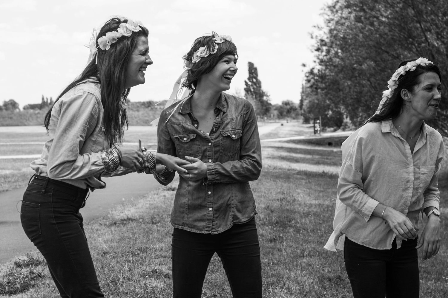 Black and white photo series showing playful interactions outdoors.