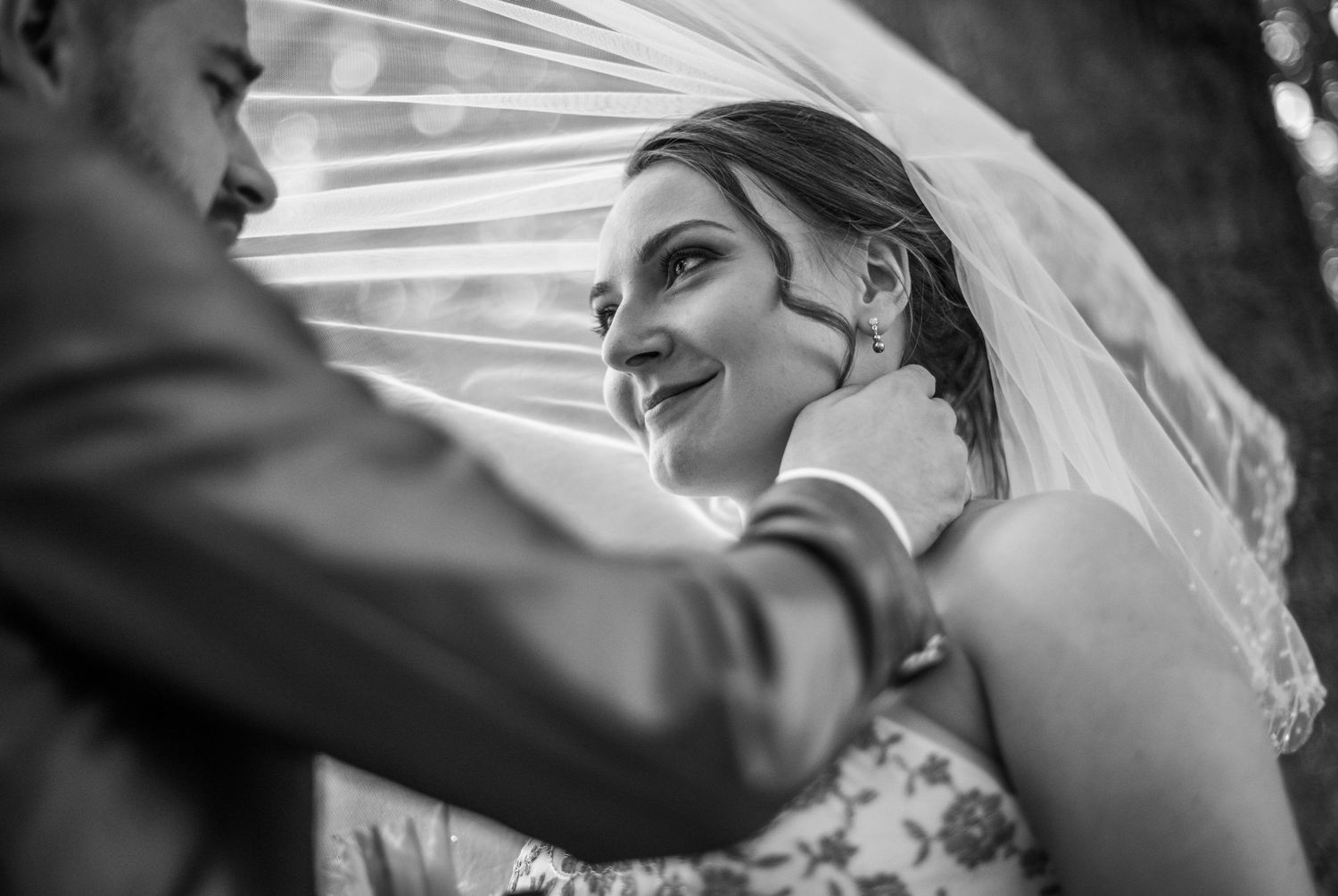 Black and white artistic shots of wedding veil details and moments.